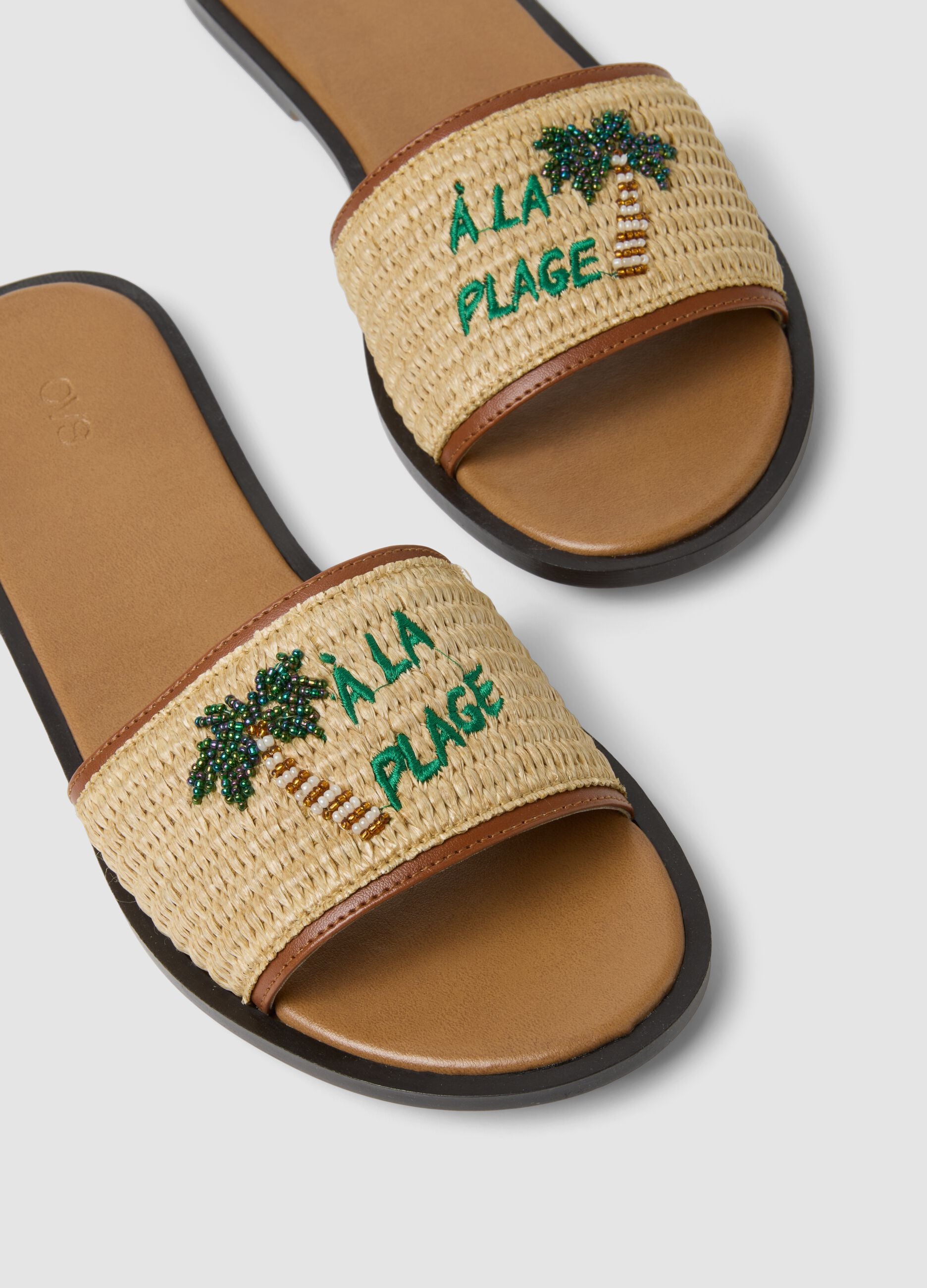 Beige flat sandals with braided embroidered strap