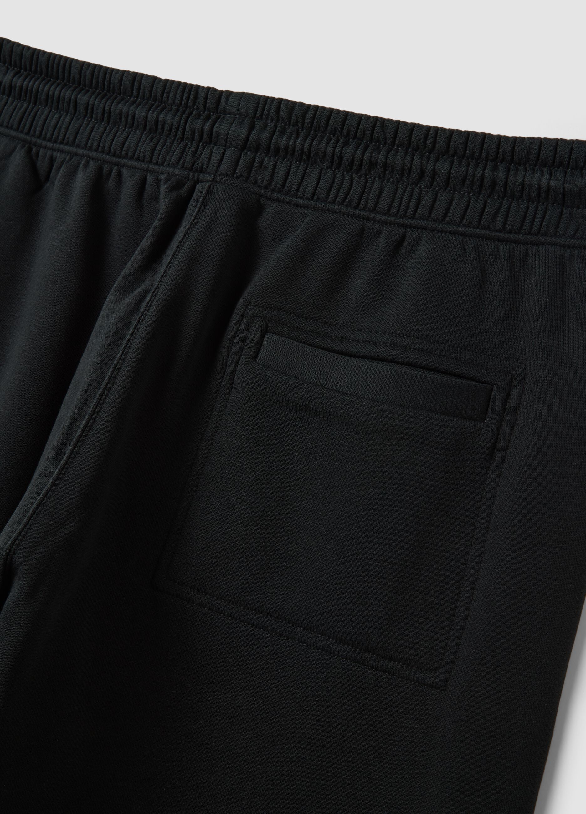 Jogger neri in misto cotone con fondo a polsino e coulisse