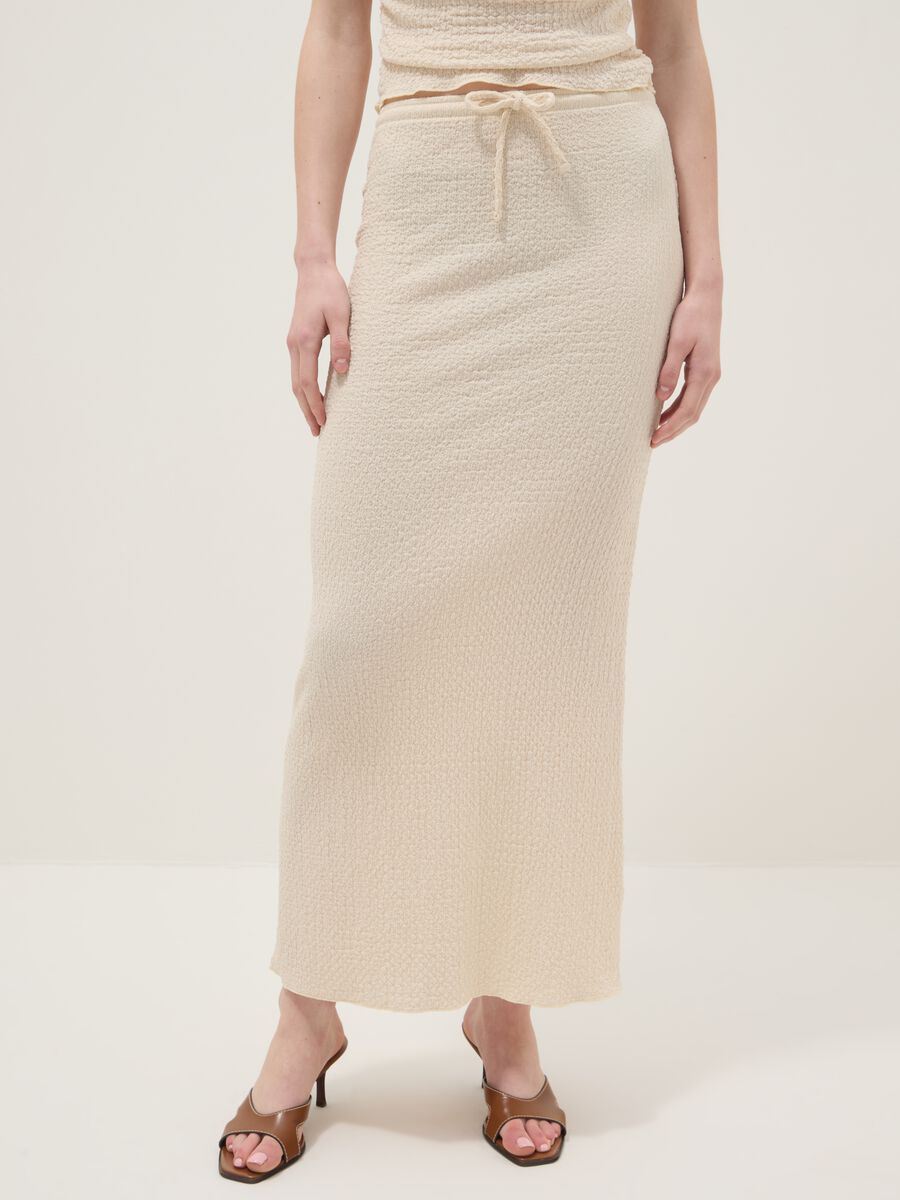 Beige long skirt in stretchy textured fabric_1