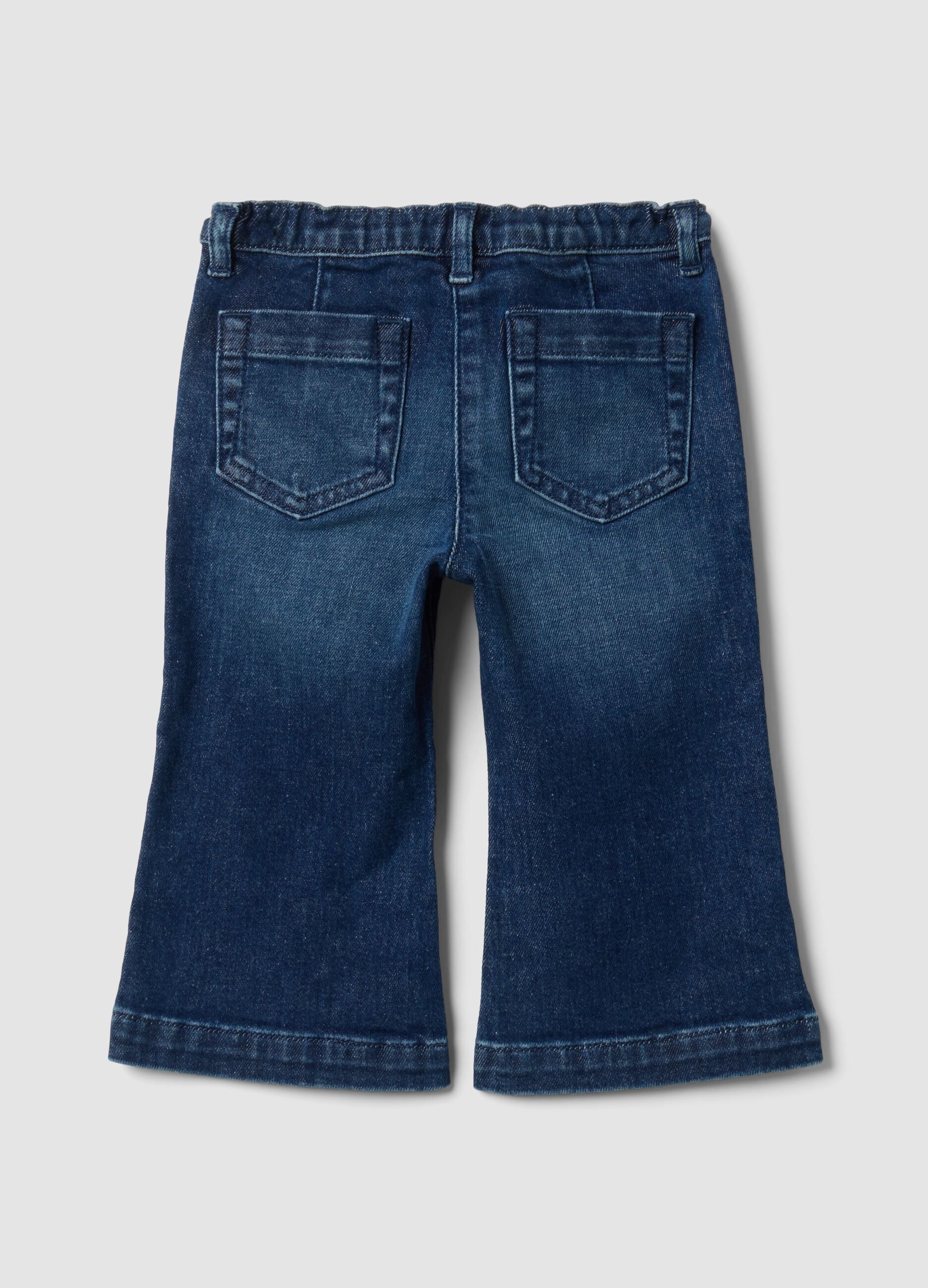 Blue flared stretch-cotton jeans with teddy bear button for baby girl
