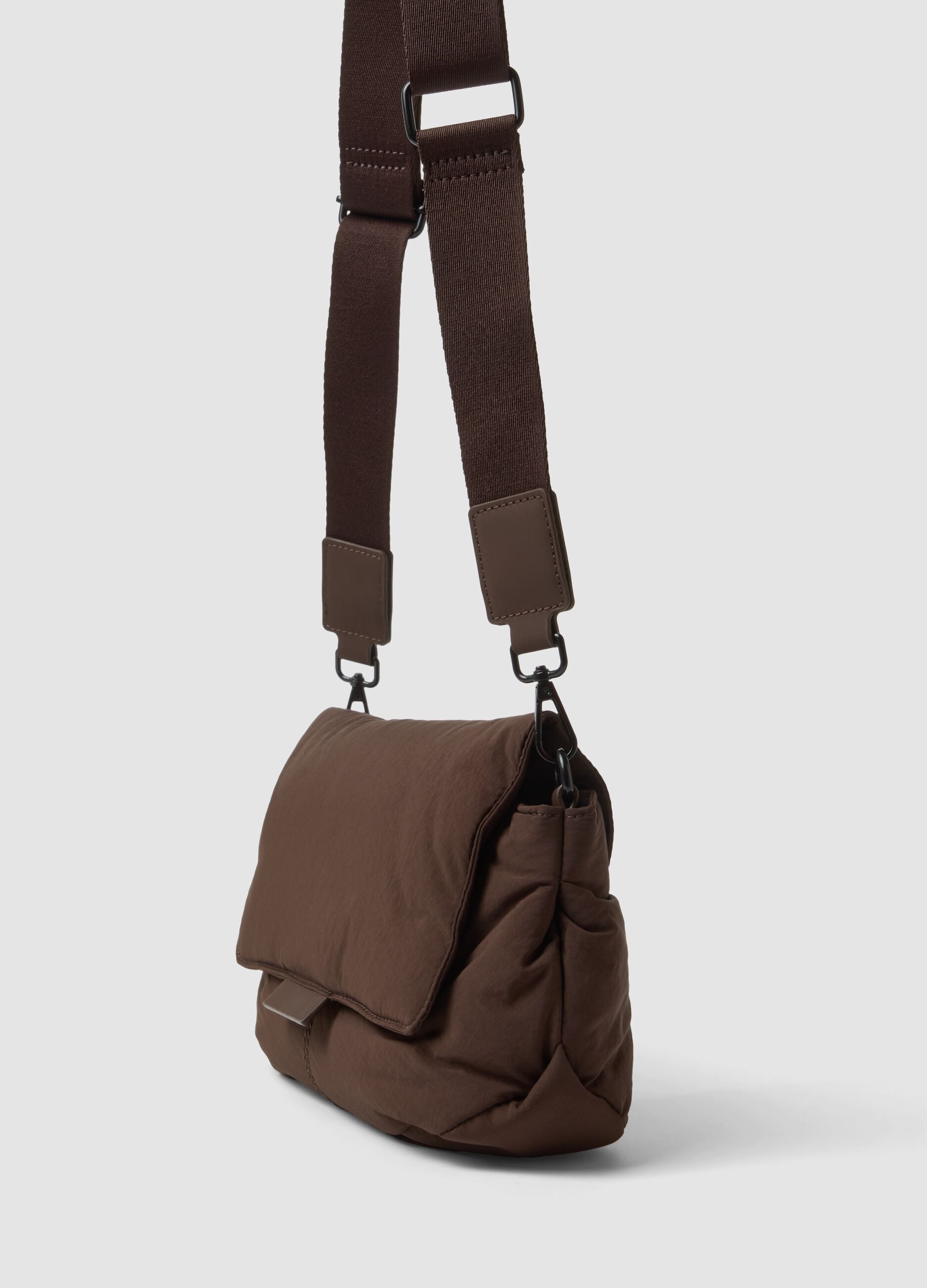 Brown crossbody bag with flap and adjustable strap