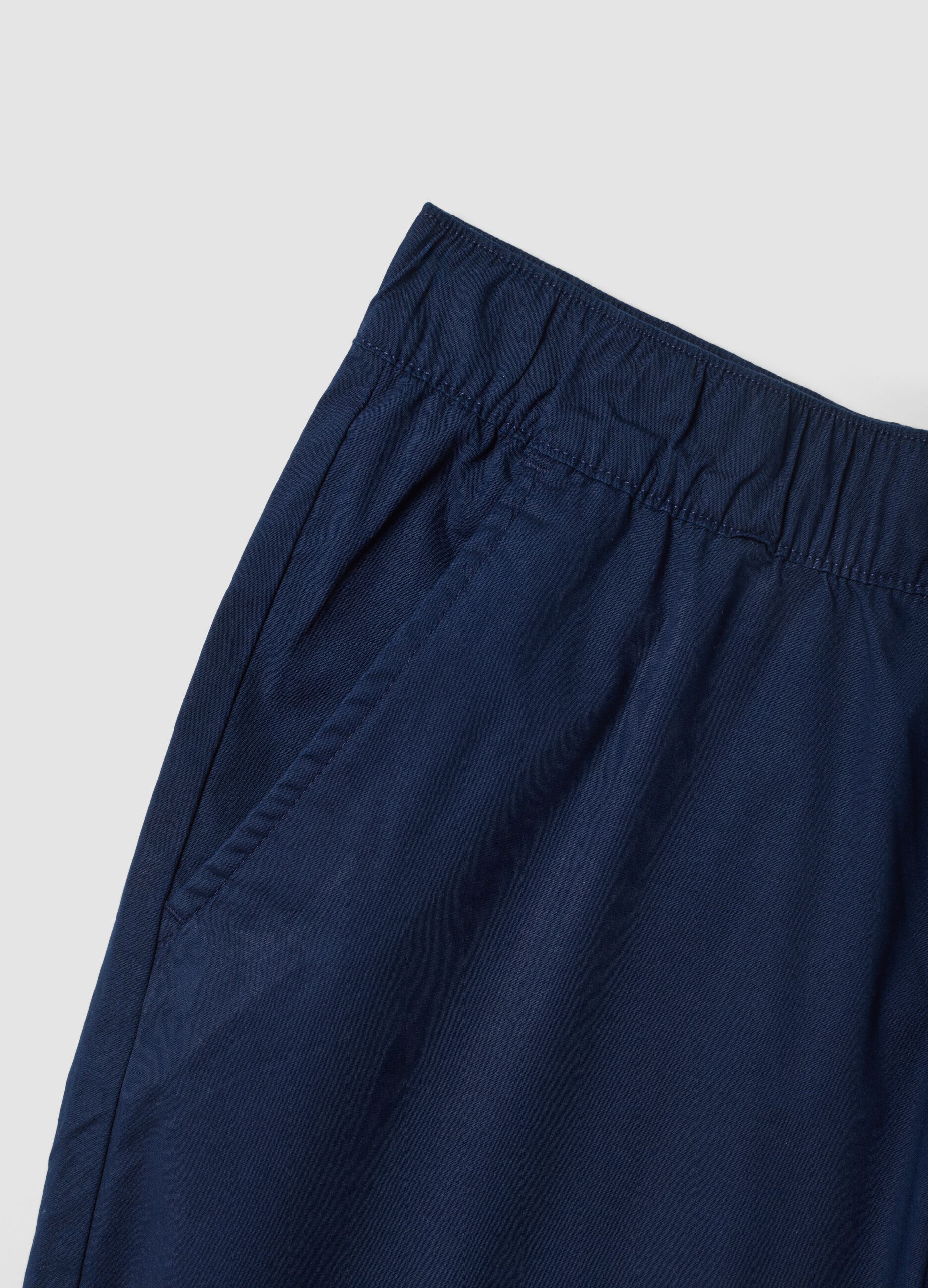 Blue stretch cotton trousers with elasticated waist