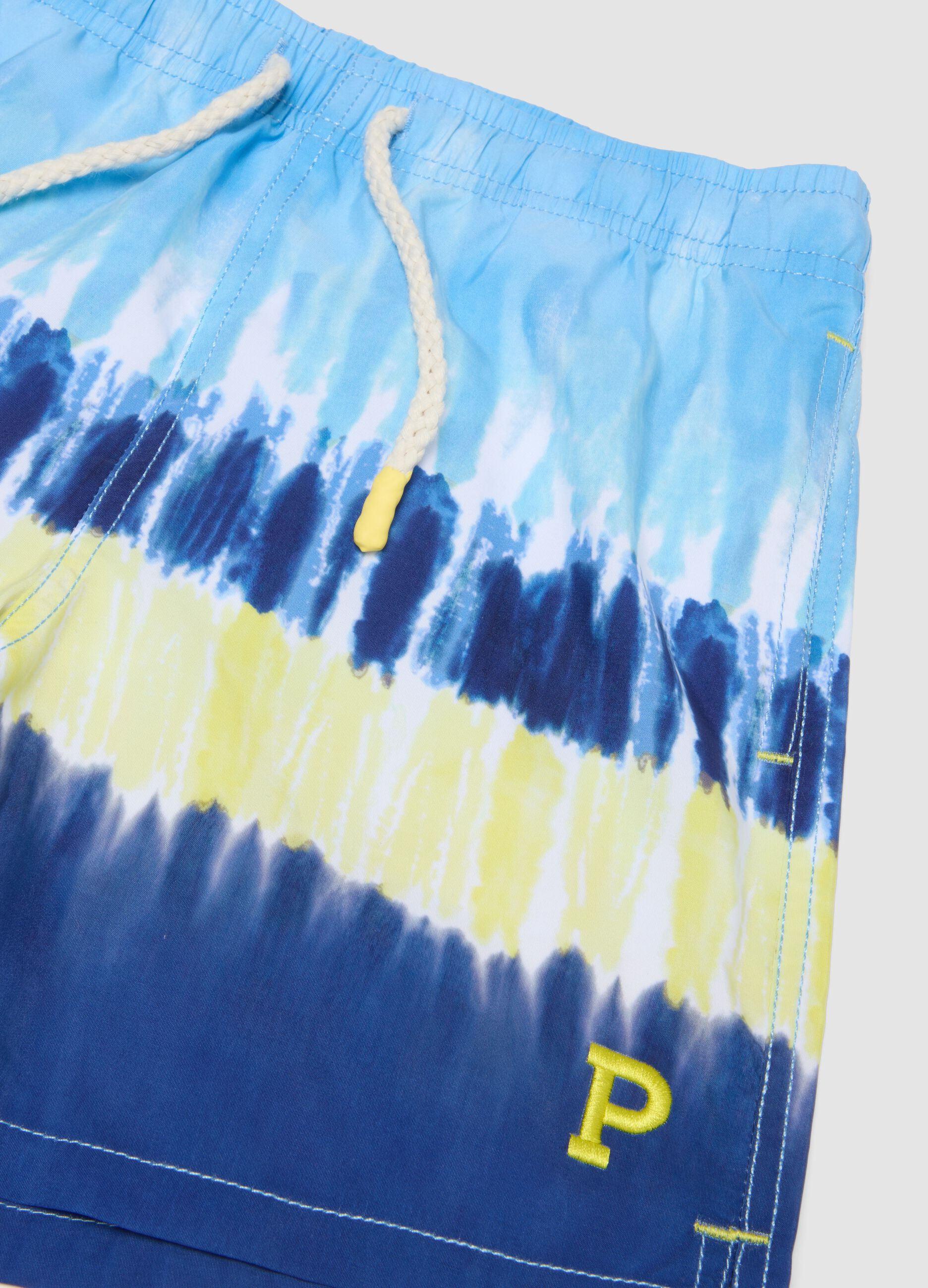 Blue tie-dye swim shorts with drawstring