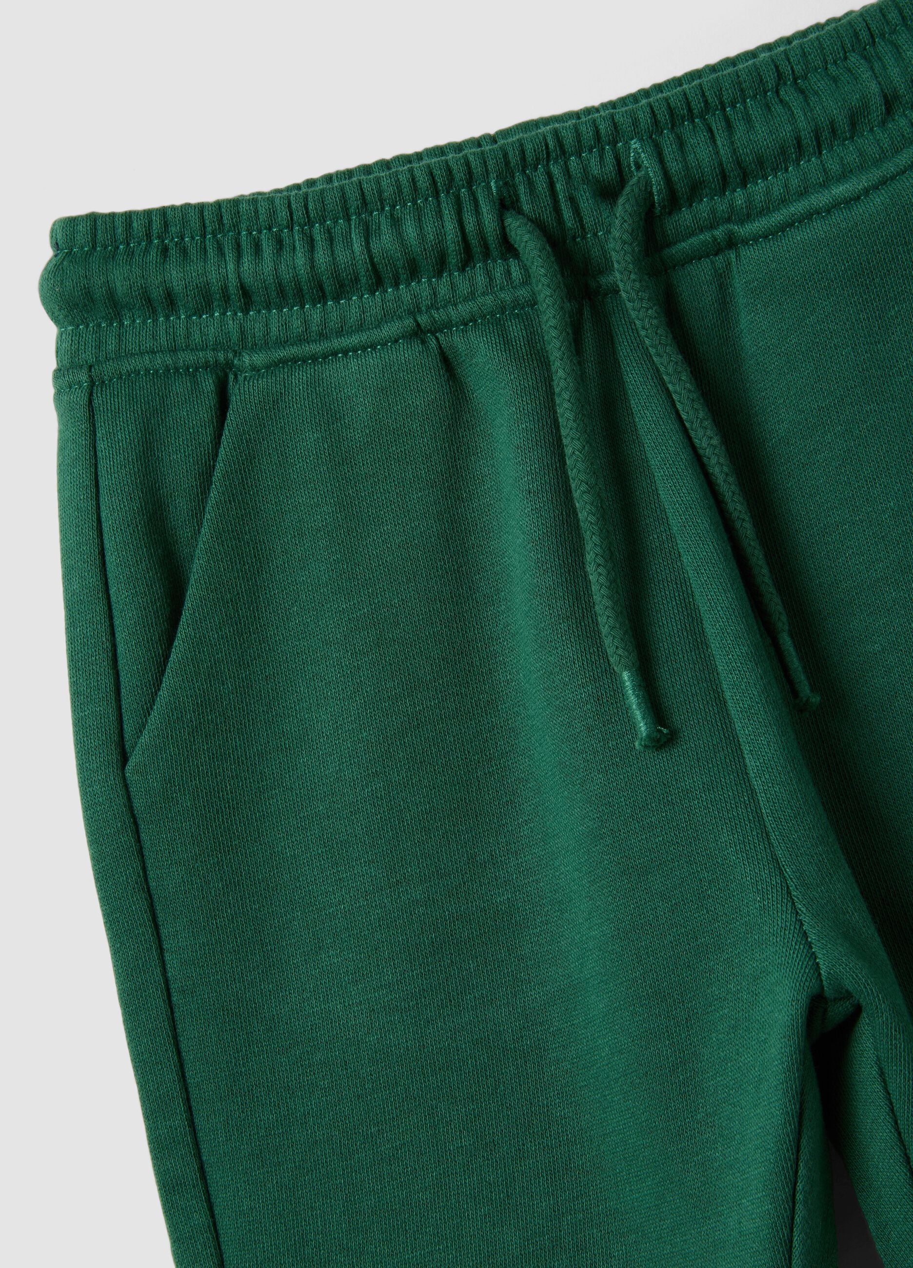 Green organic cotton joggers with drawstring for baby boy