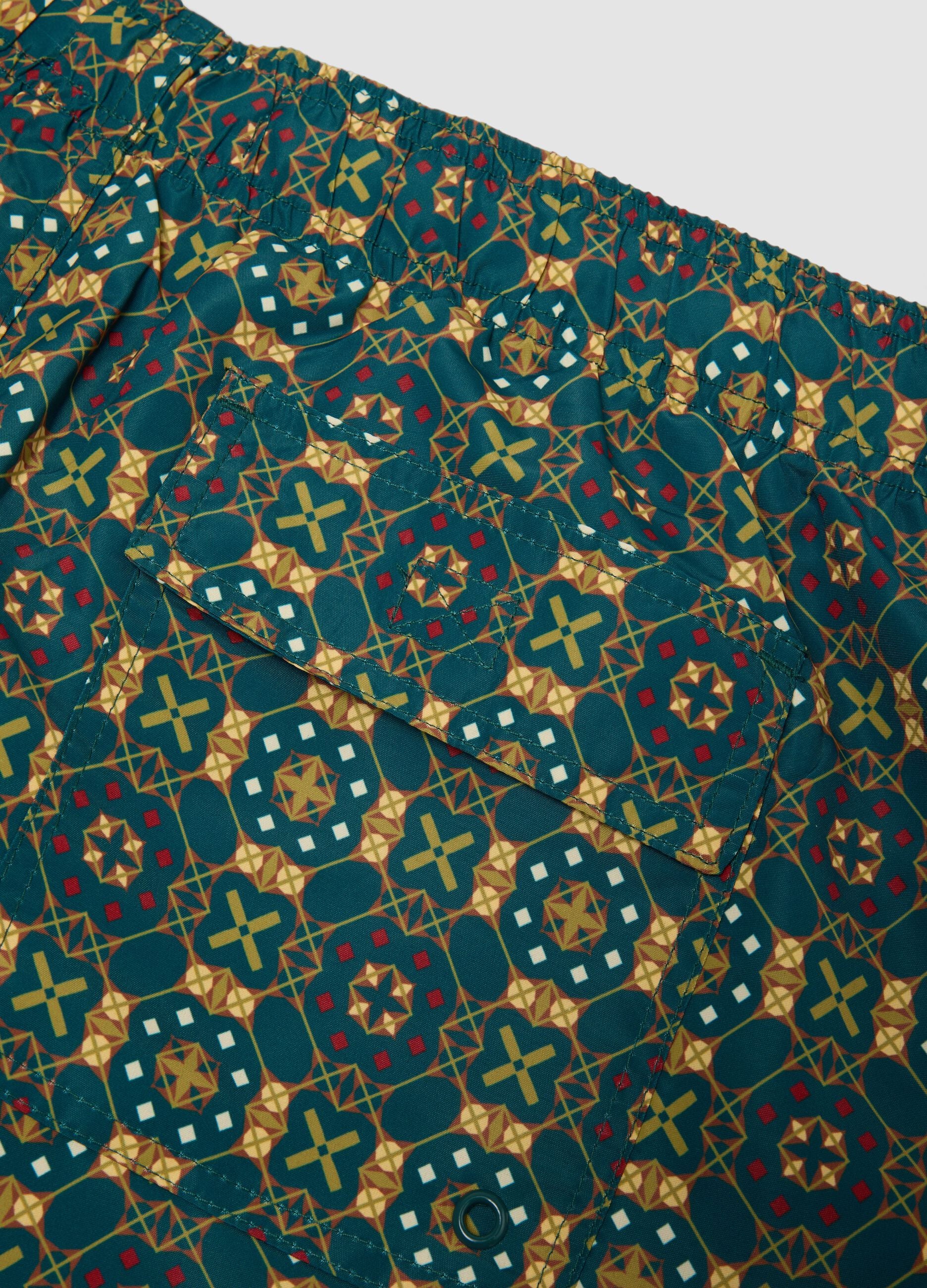 Green patterned swim shorts with elasticated waist