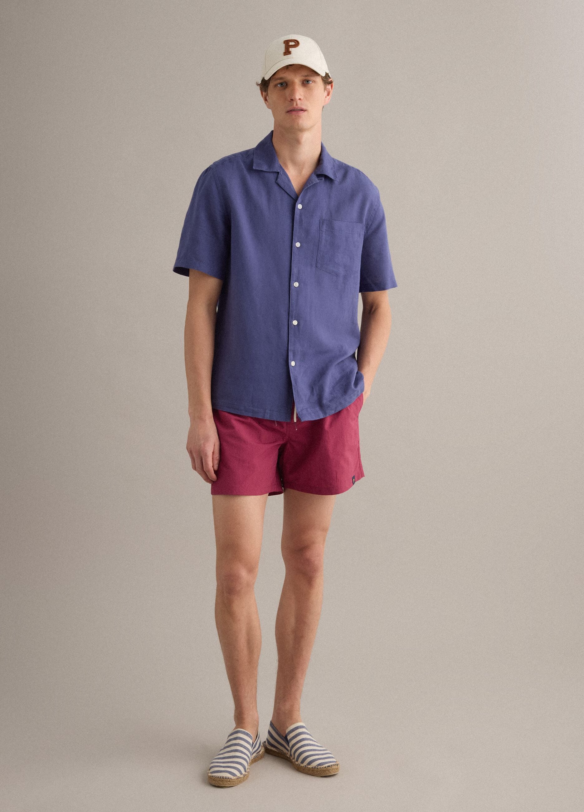 Red swim shorts with elasticated waistband and drawstring