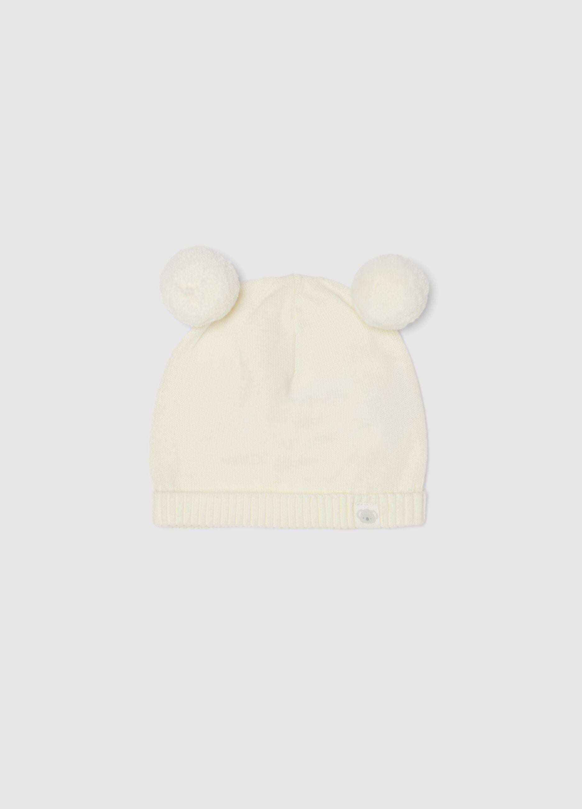 White pure organic cotton knitted baby hat with pom‑poms