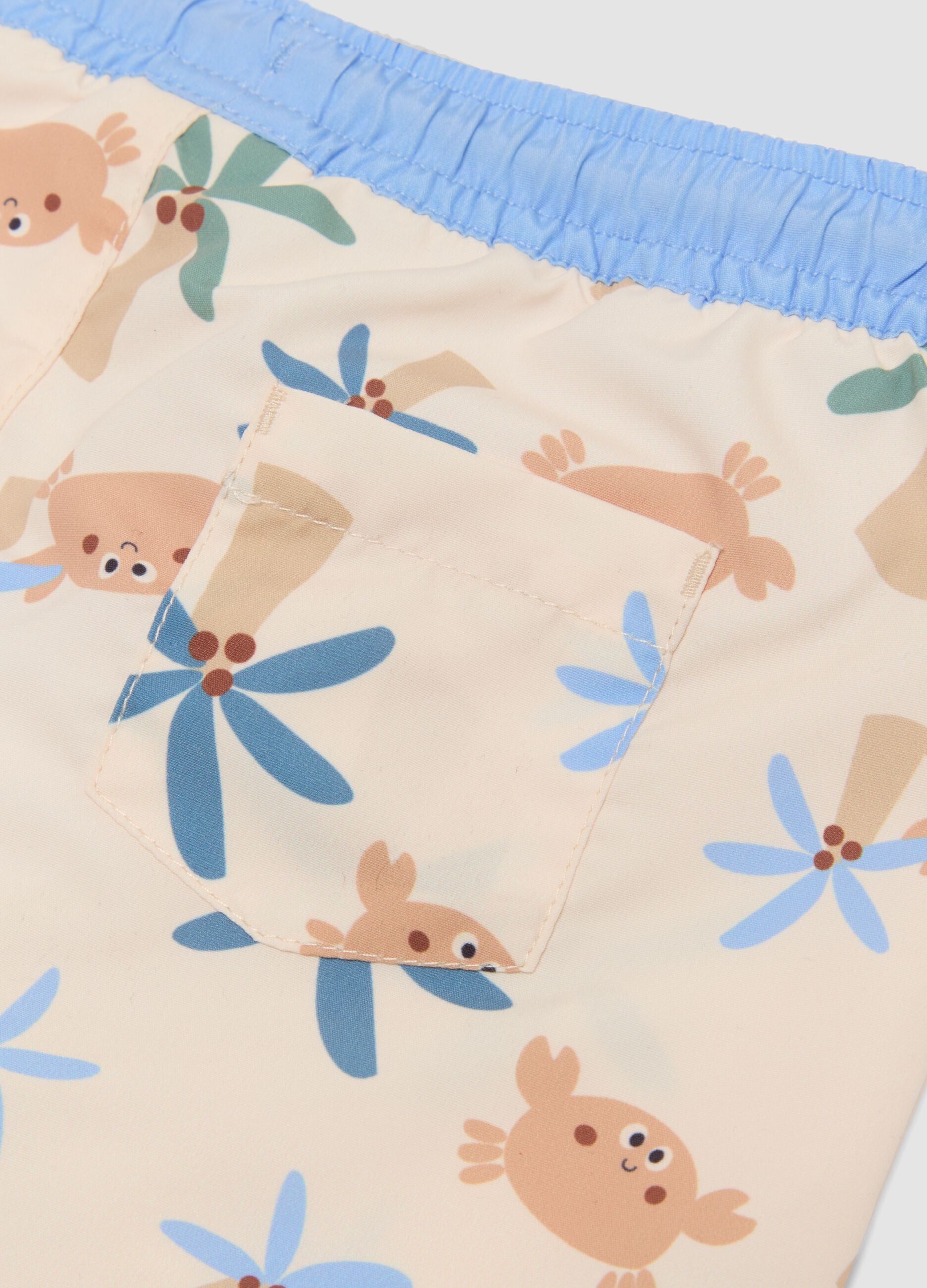 Beige tropical-print swim shorts for baby boys