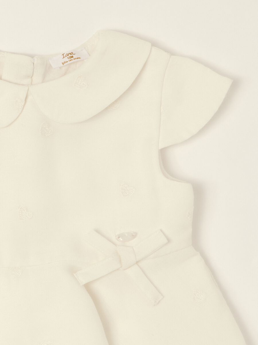 White dress with embroidered details_1