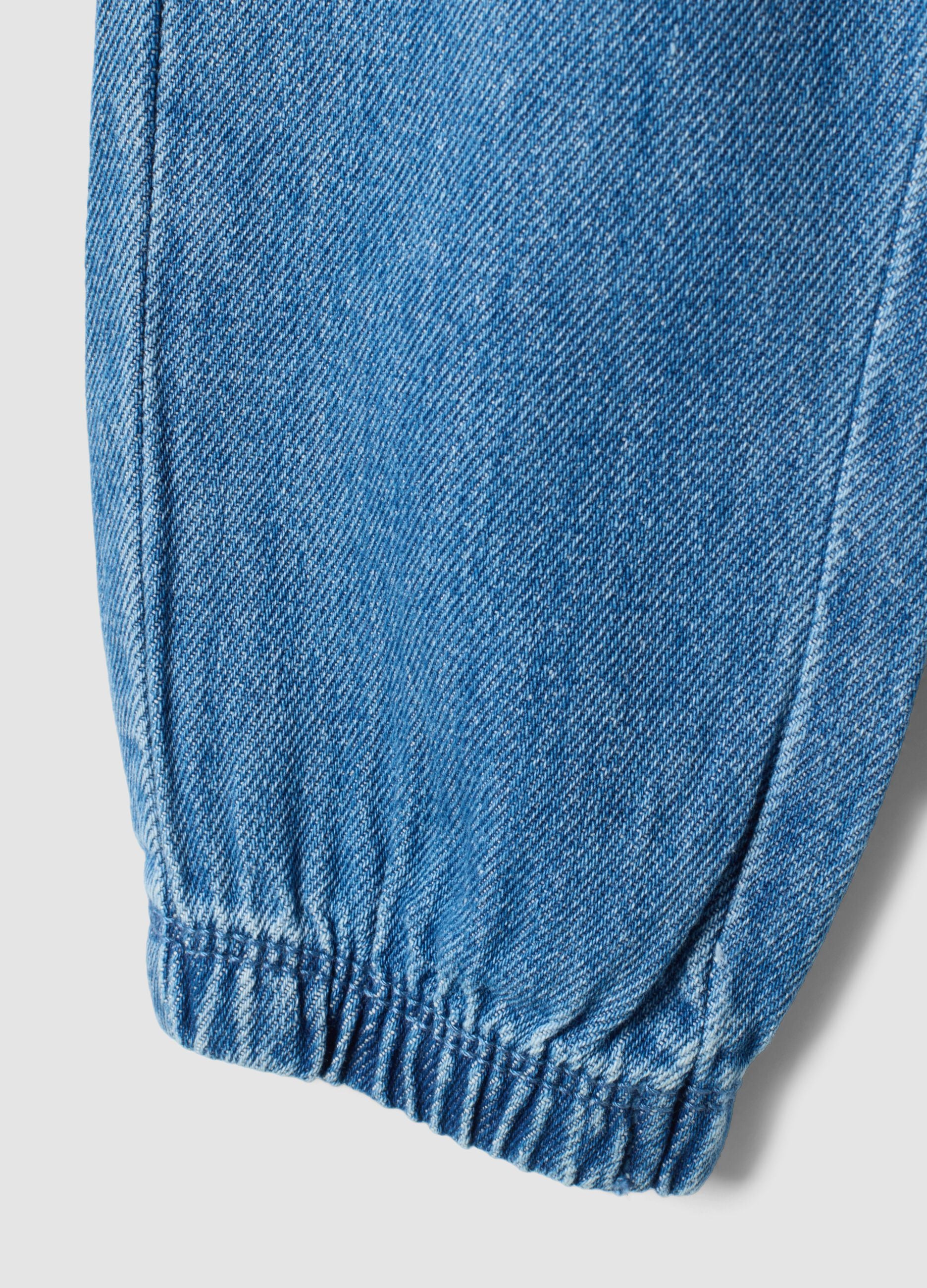 Blue denim trousers in a cotton and viscose blend with an elasticated waistband