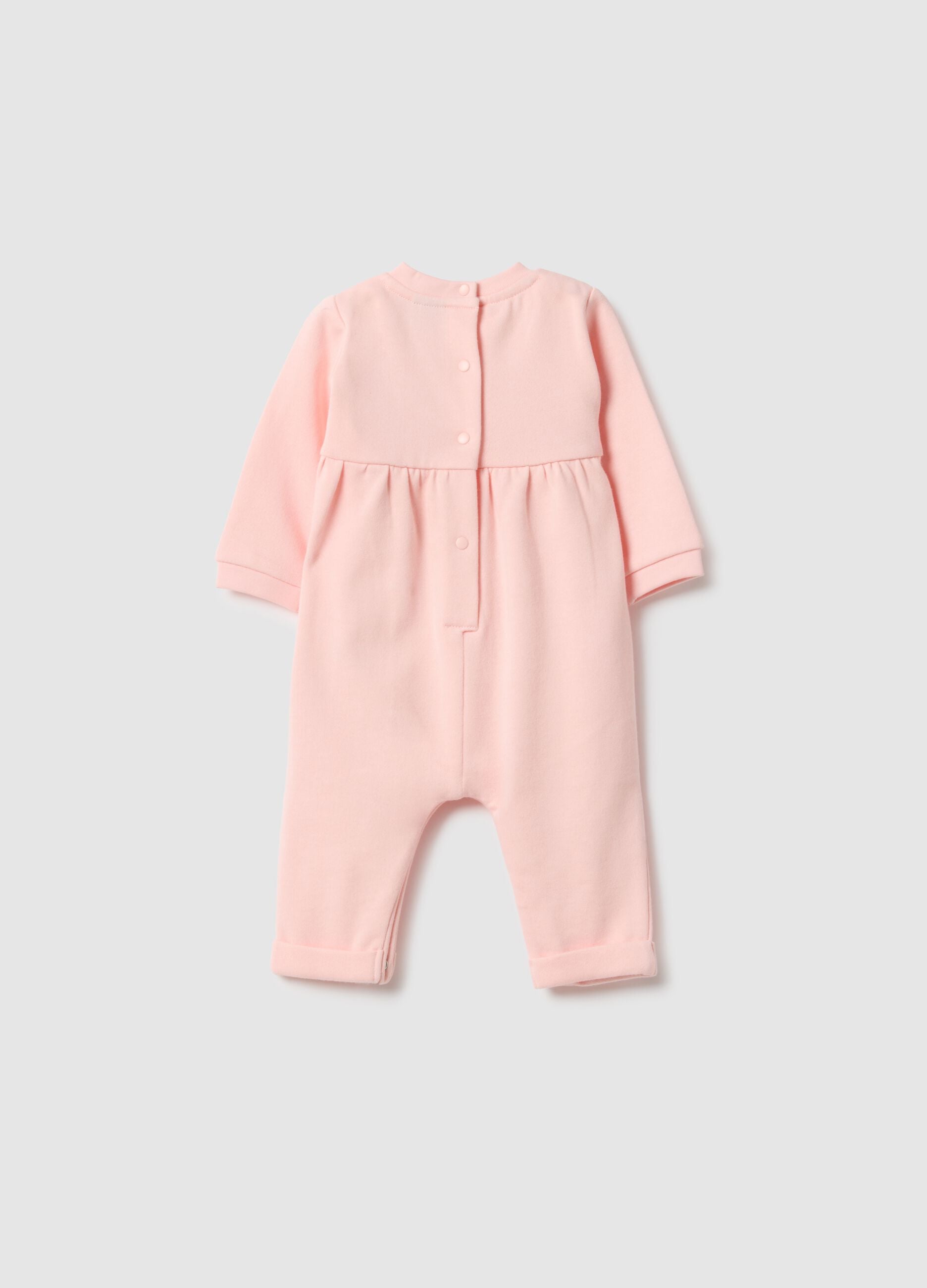 Baby girl's pink cotton sleepsuit with embroidered details