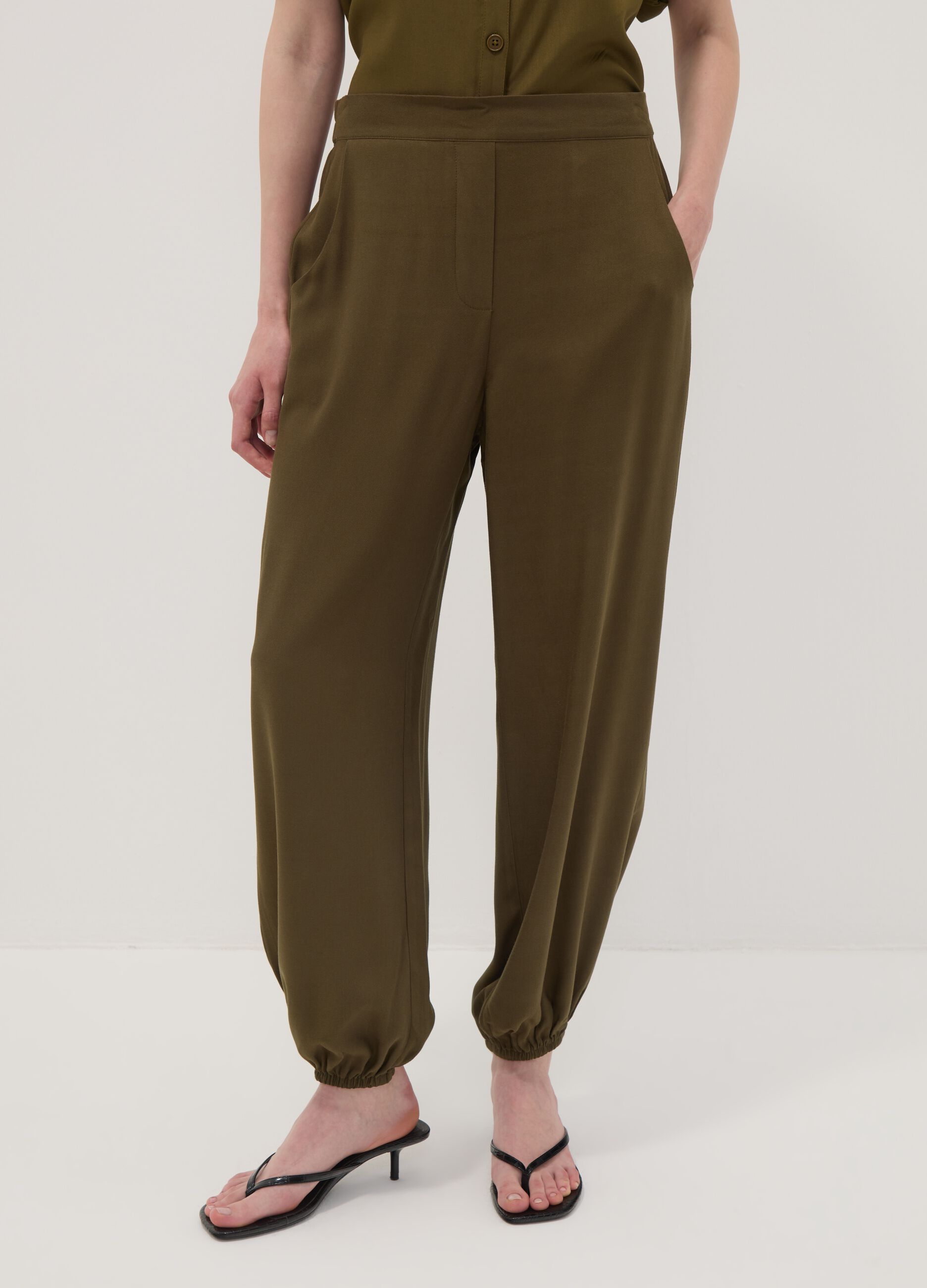 Green pure viscose trousers with elasticated cuffs, regular fit