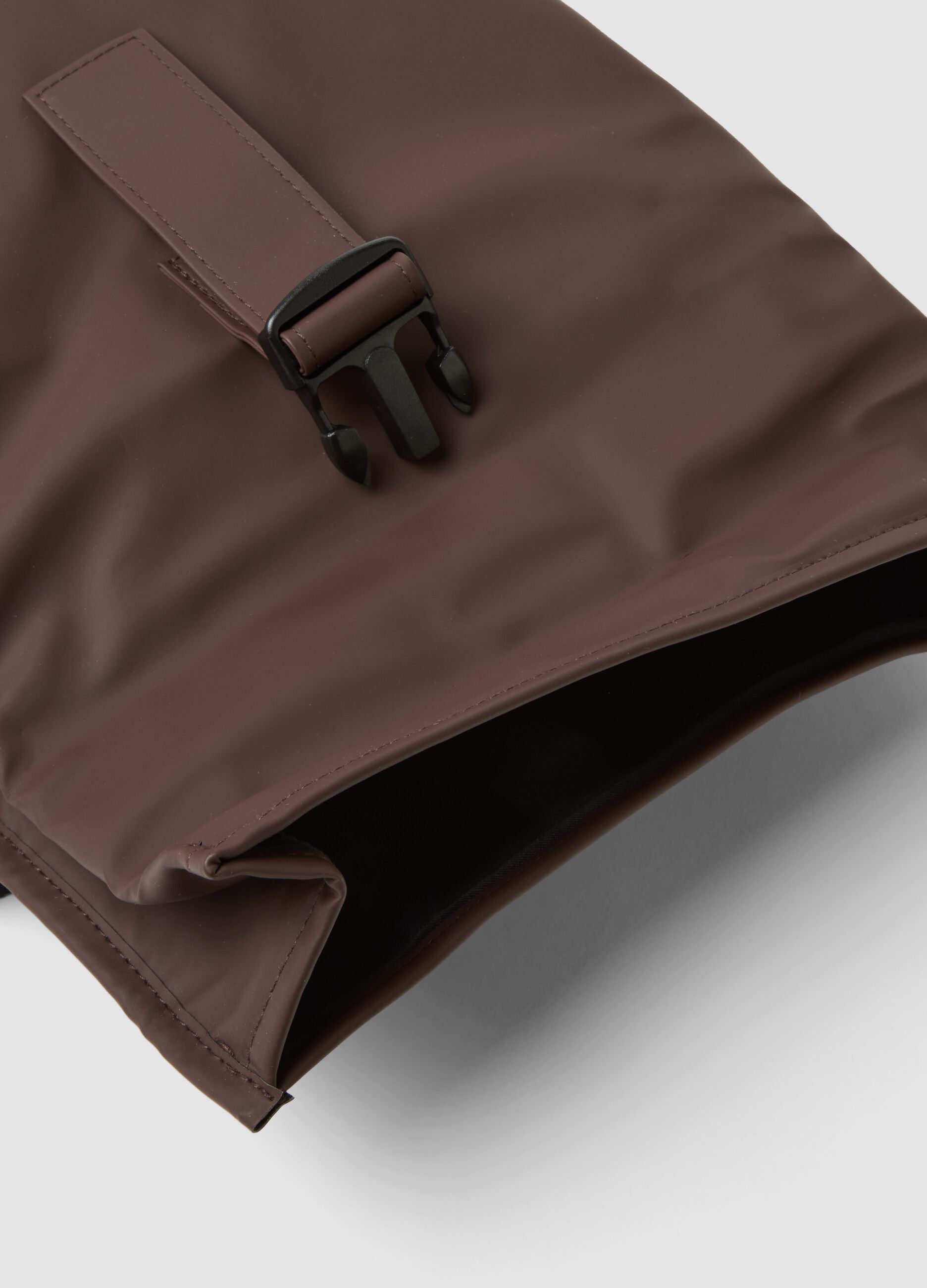 Brown roll-top backpack with front zip pocket