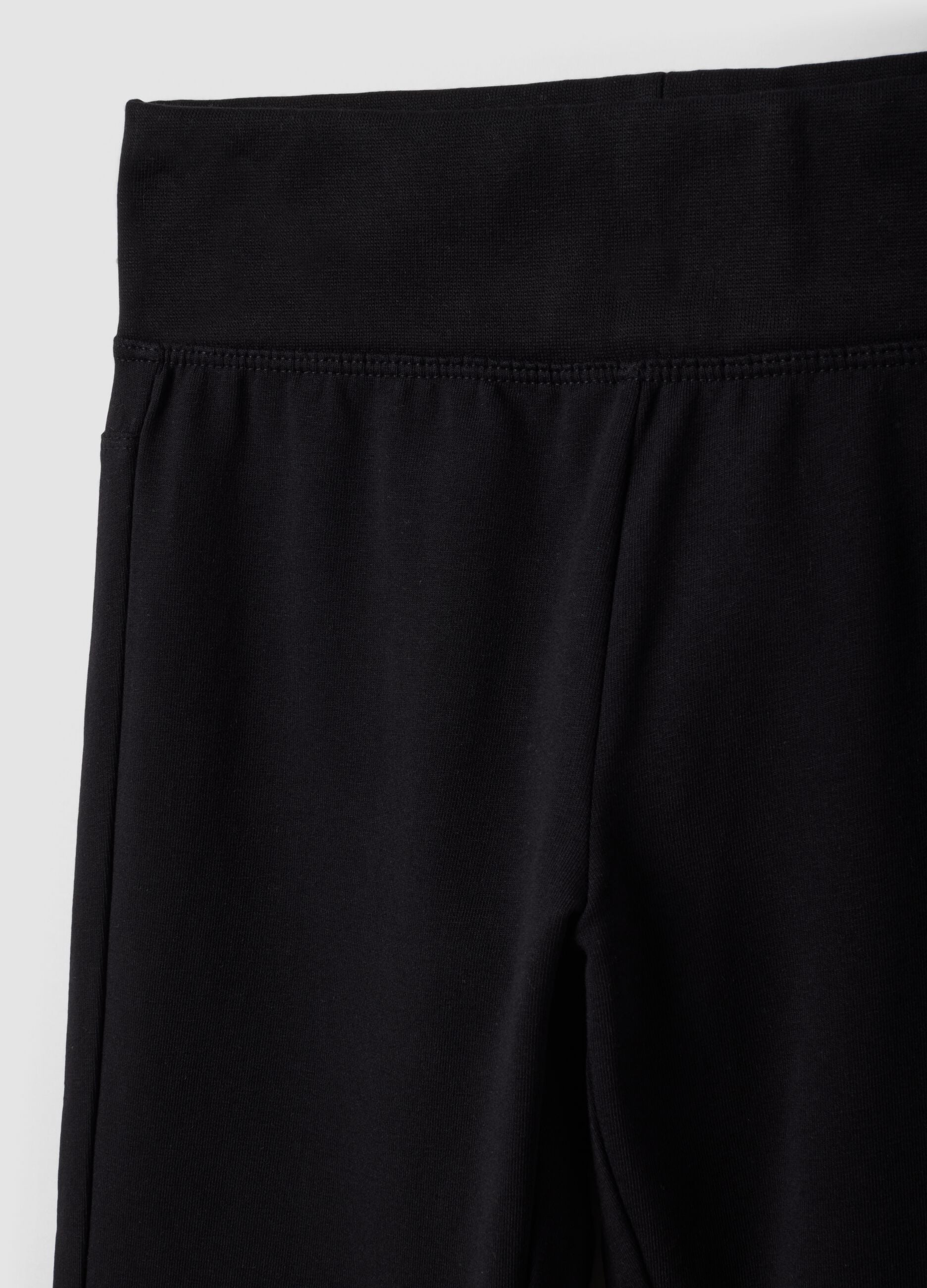 Black flared stretch organic cotton trousers for girls