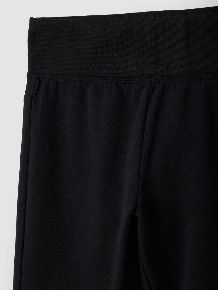 Black flared stretch organic cotton trousers for girls_5