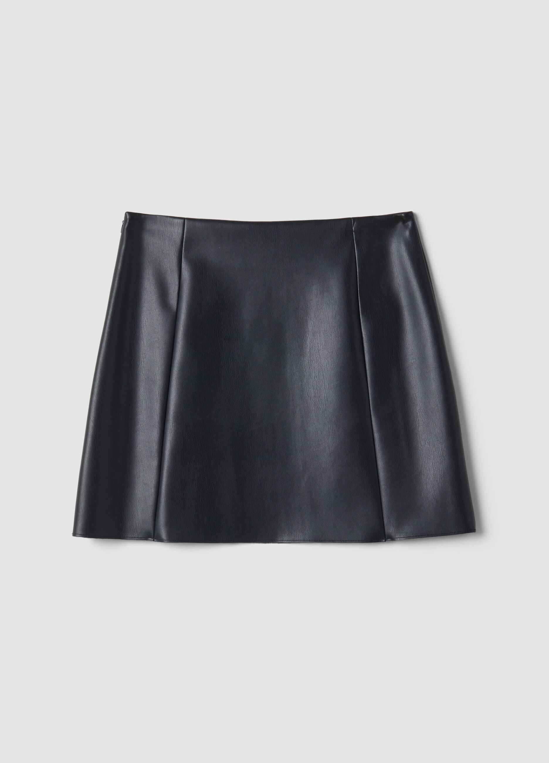 Short black A-line skirt with decorative flap pockets