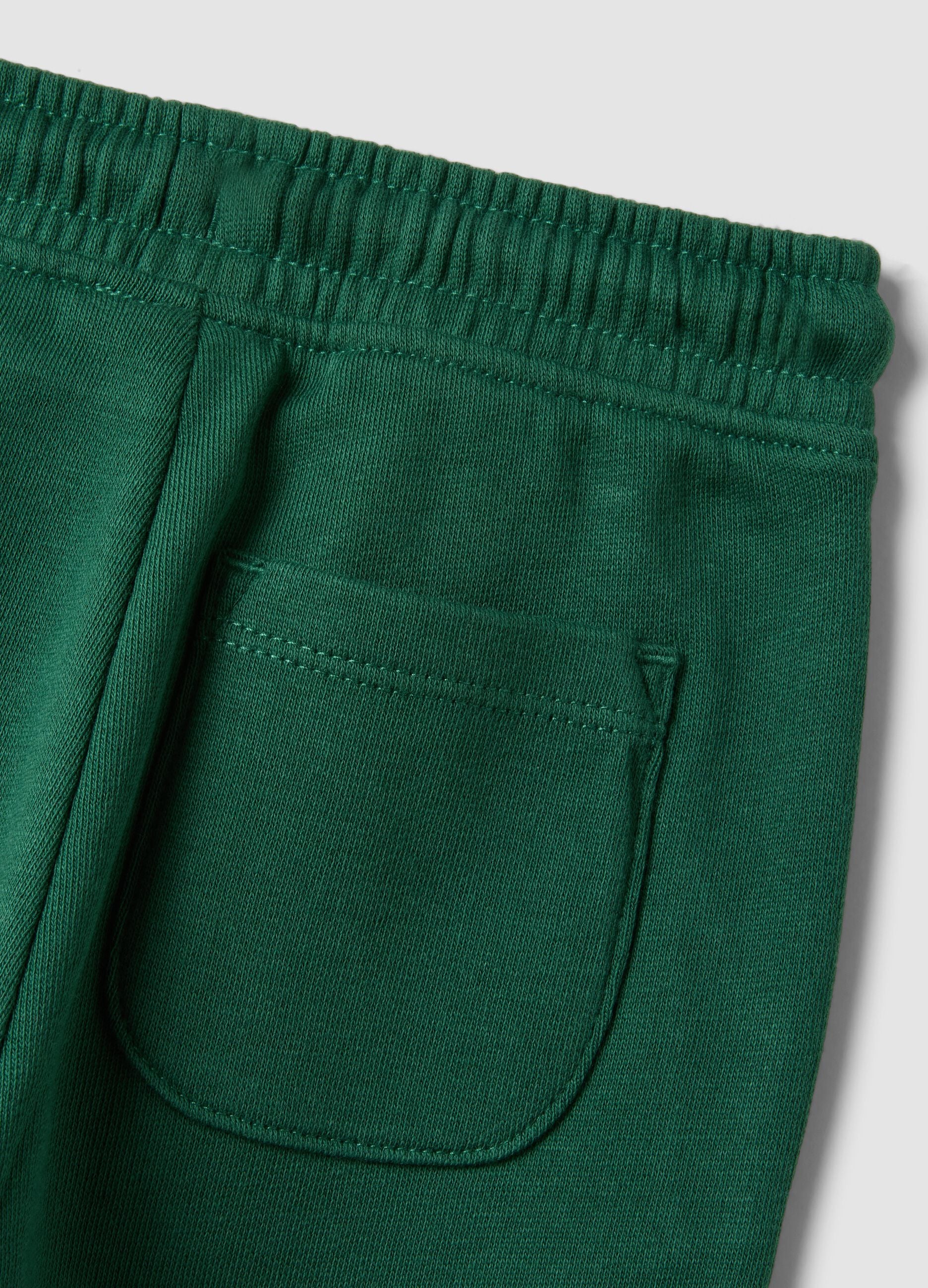 Green organic cotton joggers with drawstring for baby boy