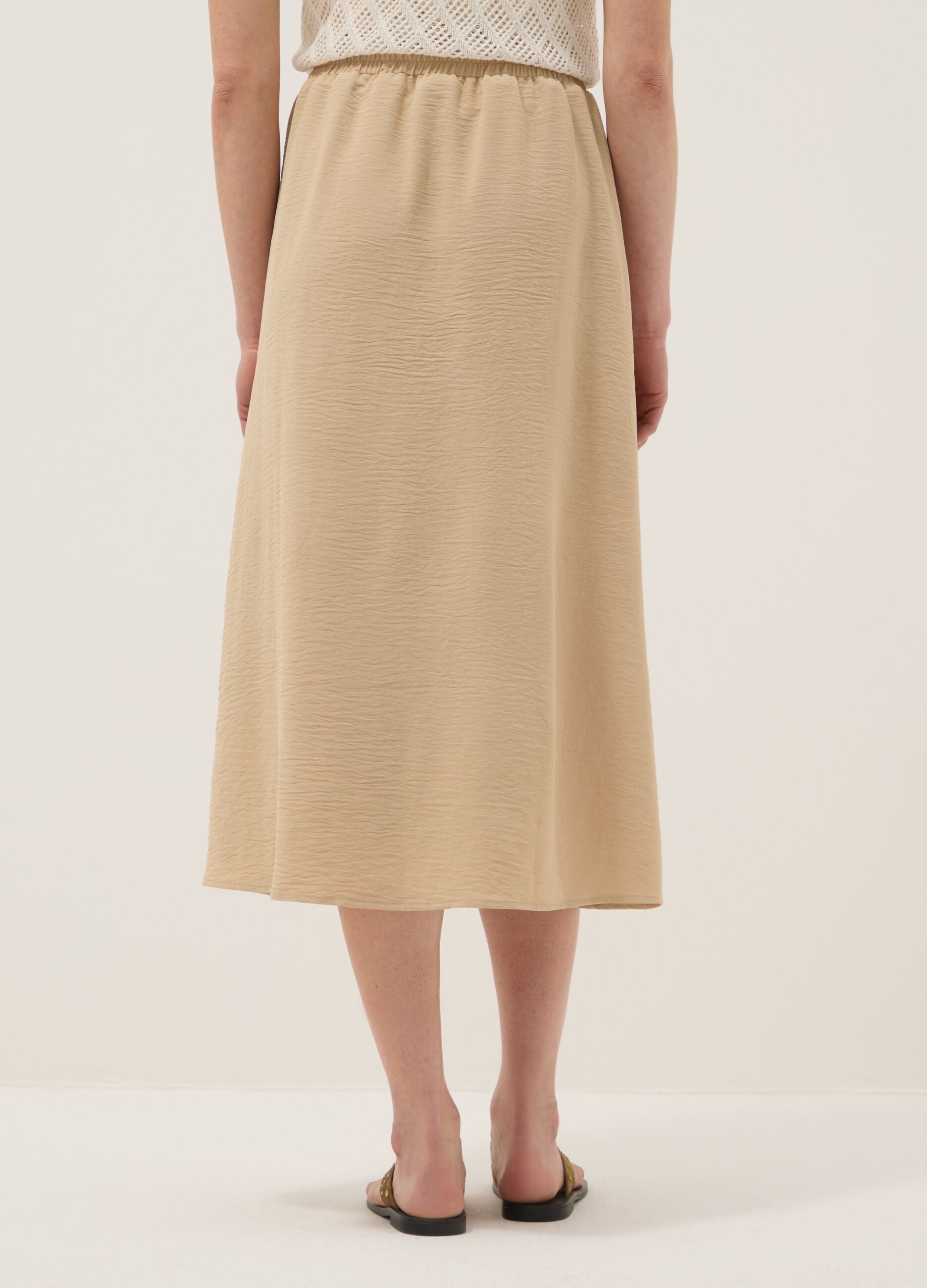 Beige long skirt, regular fit with elasticated waist and slit
