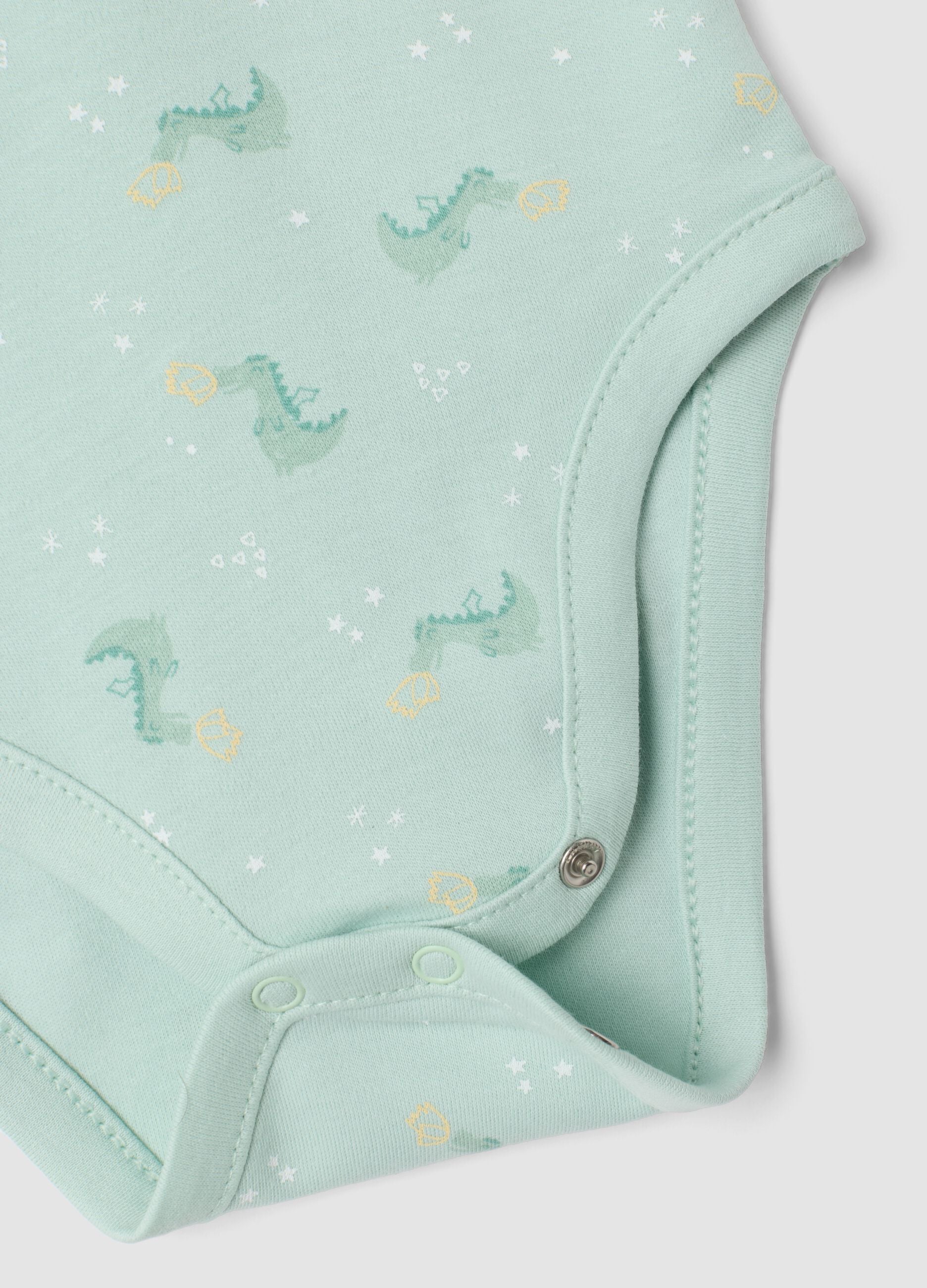 3-pack of green and white organic cotton baby bodysuits