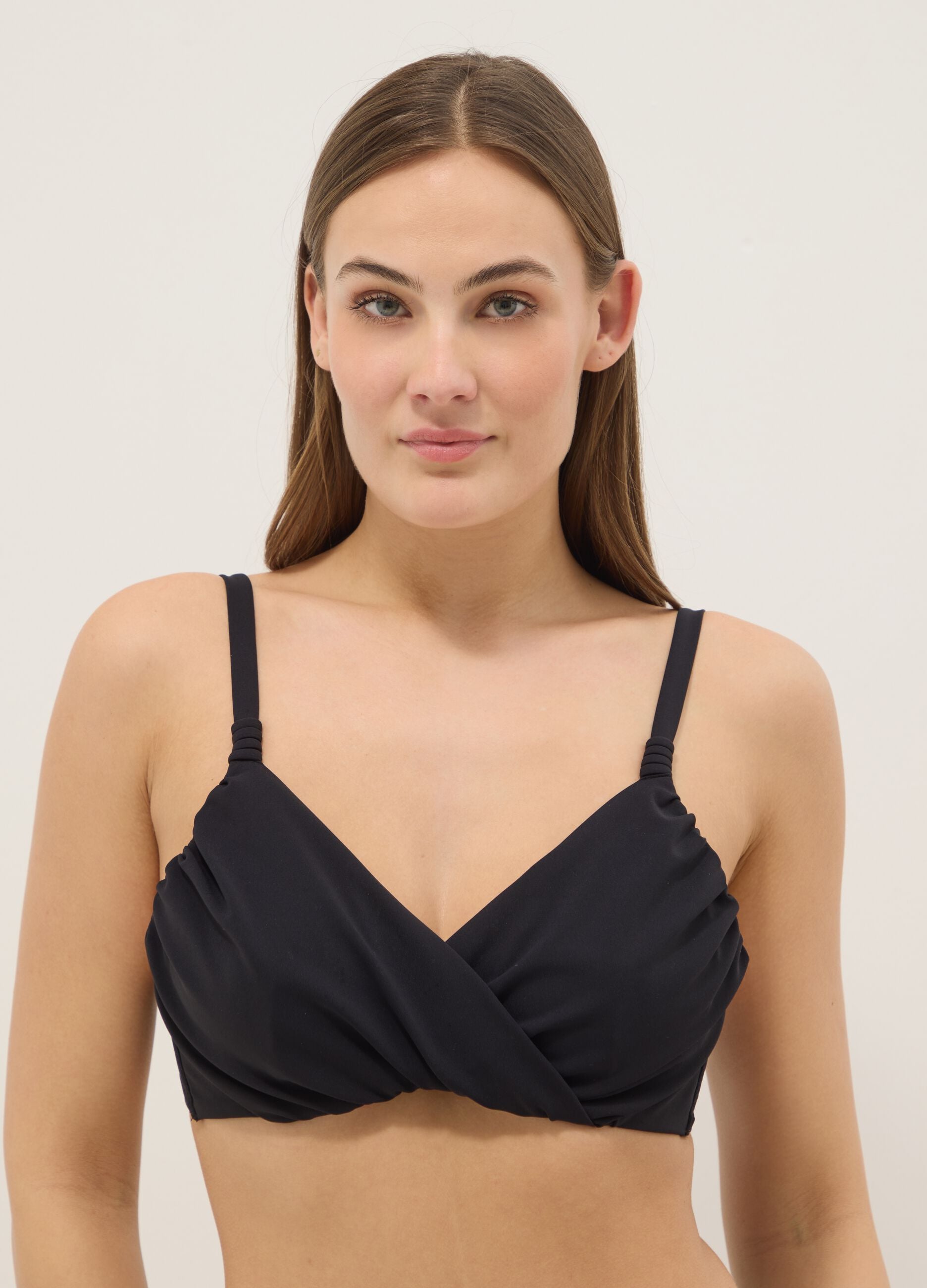 Black bikini top in stretch fabric with shaping effect