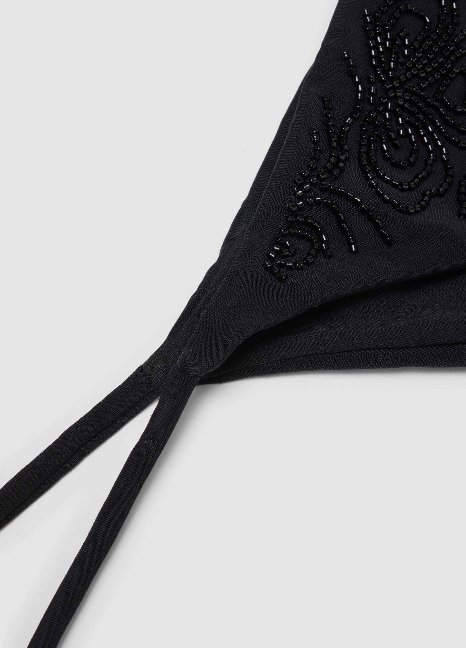 Black stretch bikini bottoms with decorative beads