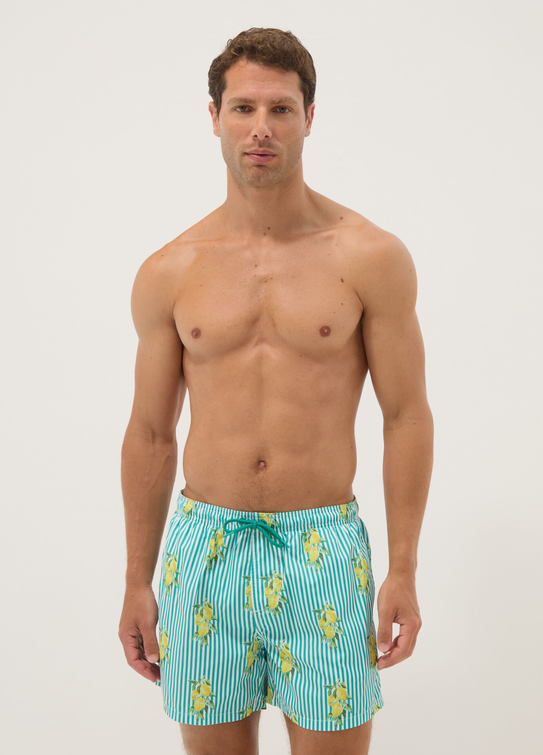 Blue striped swim shorts with lemon print