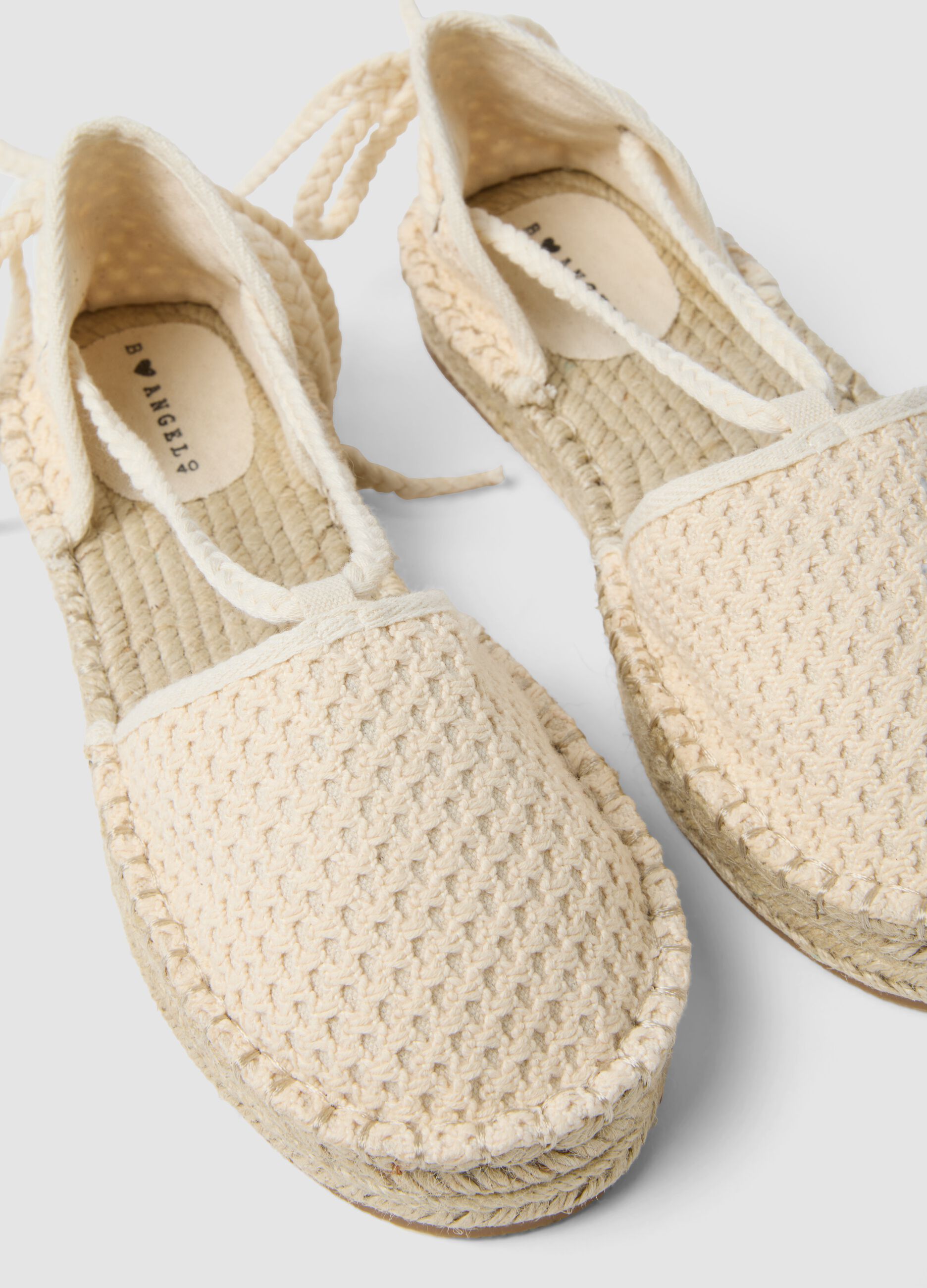 White mesh-textured sandals with laces