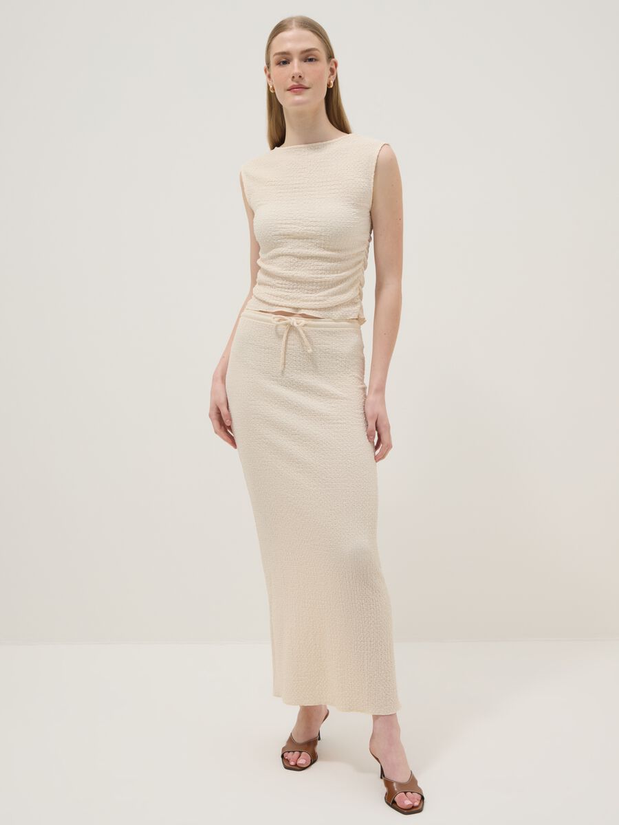 Beige long skirt in stretchy textured fabric_0