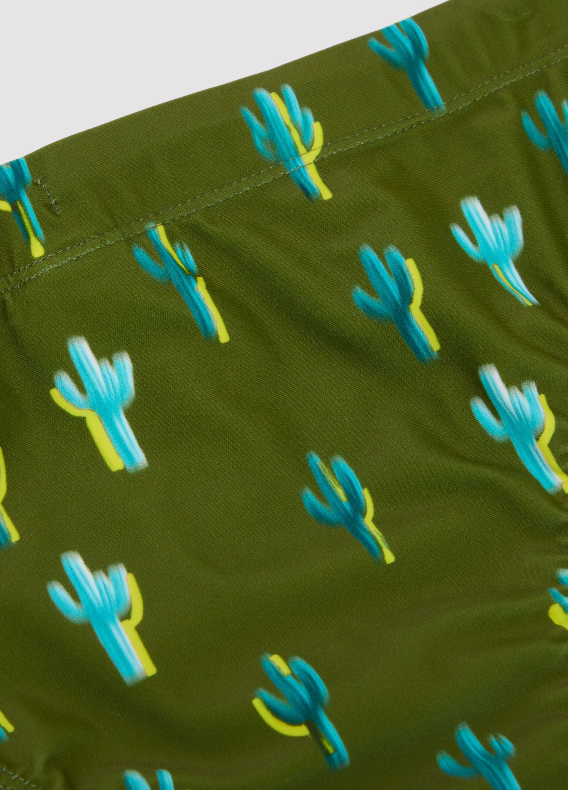 Green stretch-fabric swim briefs
