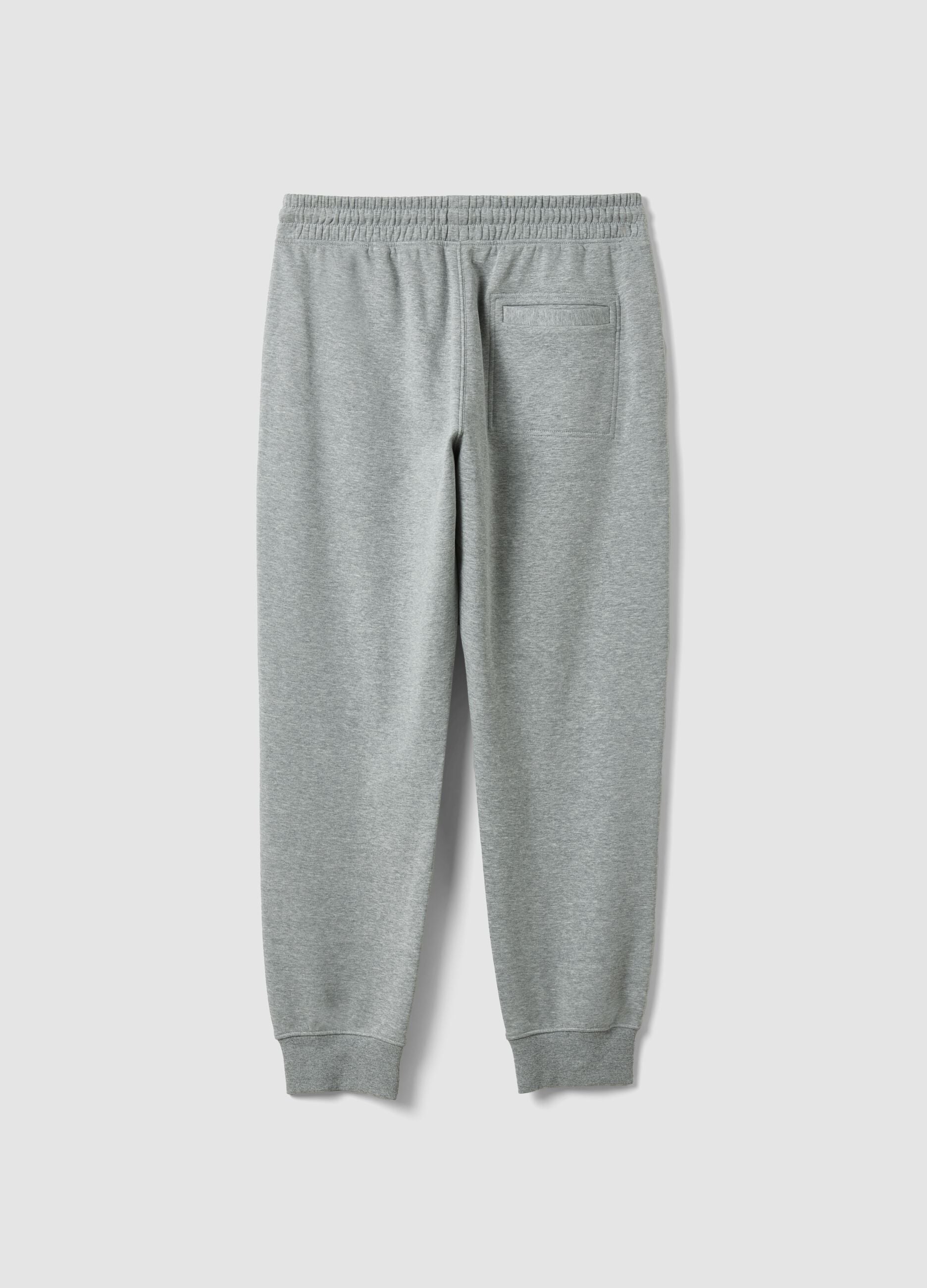 Grey cotton-blend joggers with cuffed hems and drawstring waist