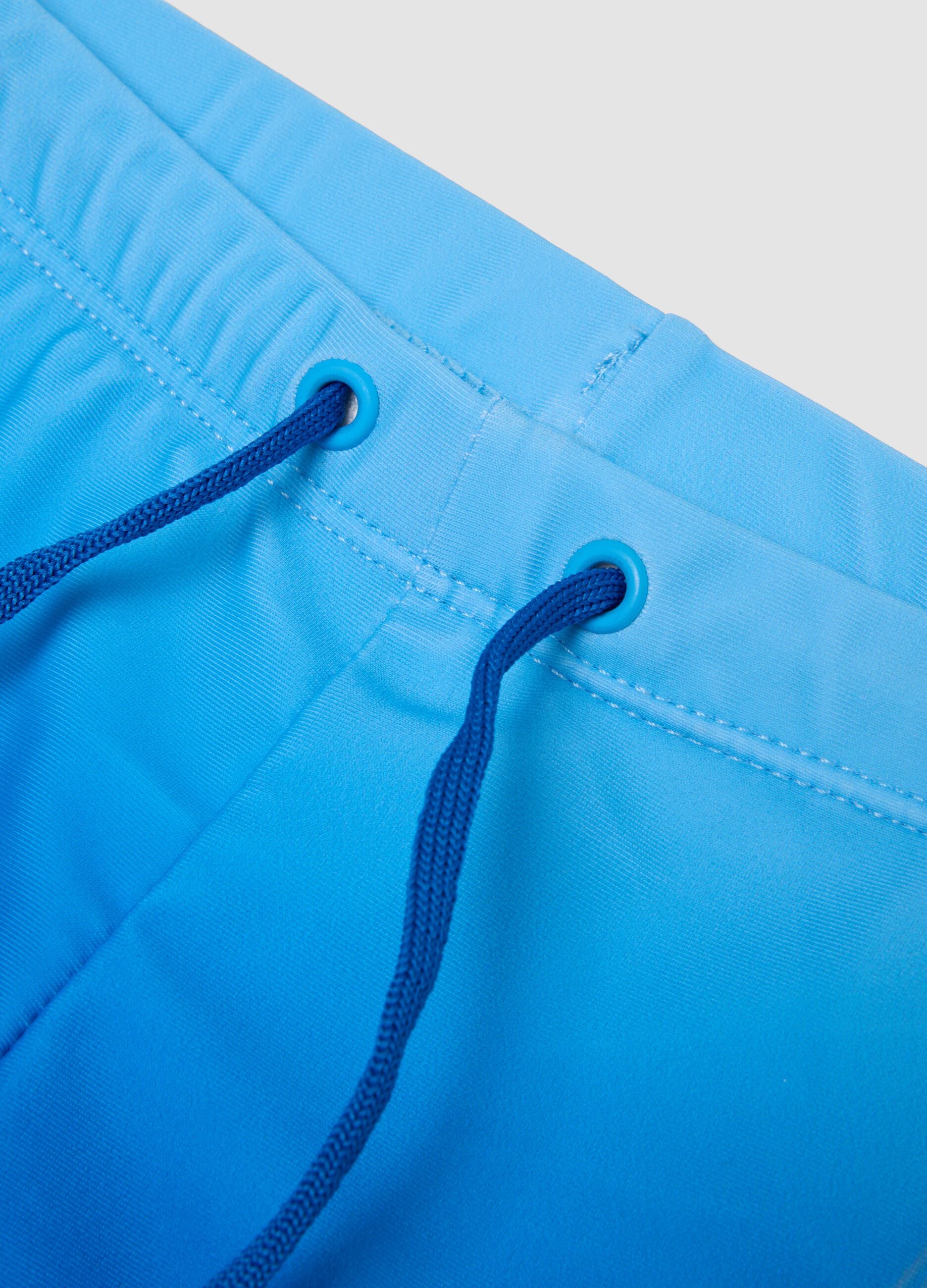 Blue stretch fabric boxer swim shorts