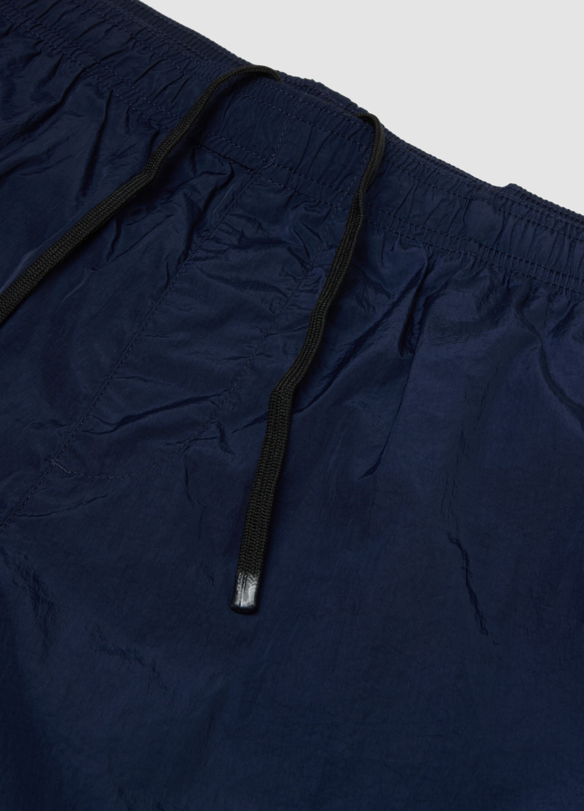 Blue swim shorts with elasticated waistband