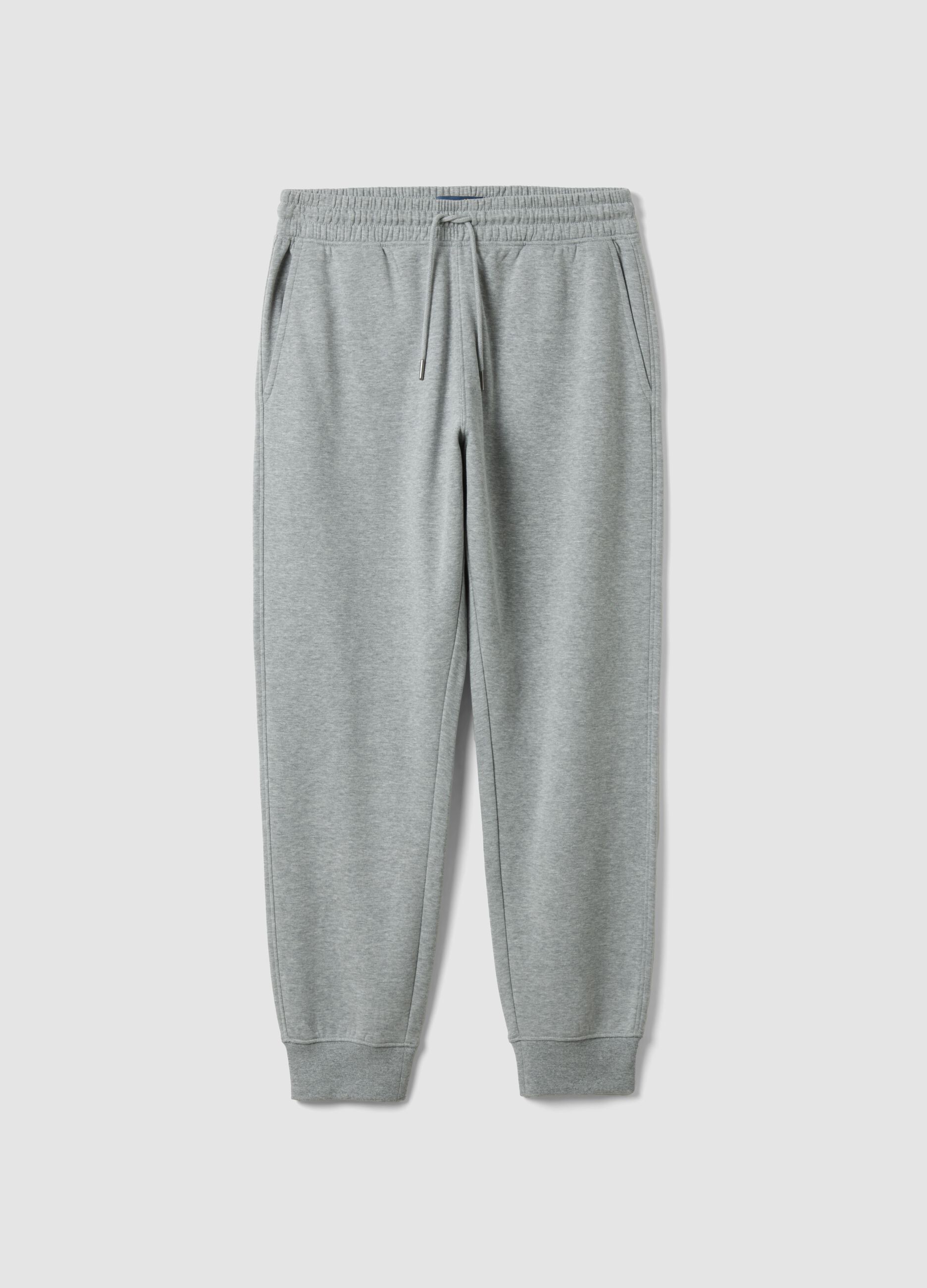 Grey cotton-blend joggers with cuffed hems and drawstring waist