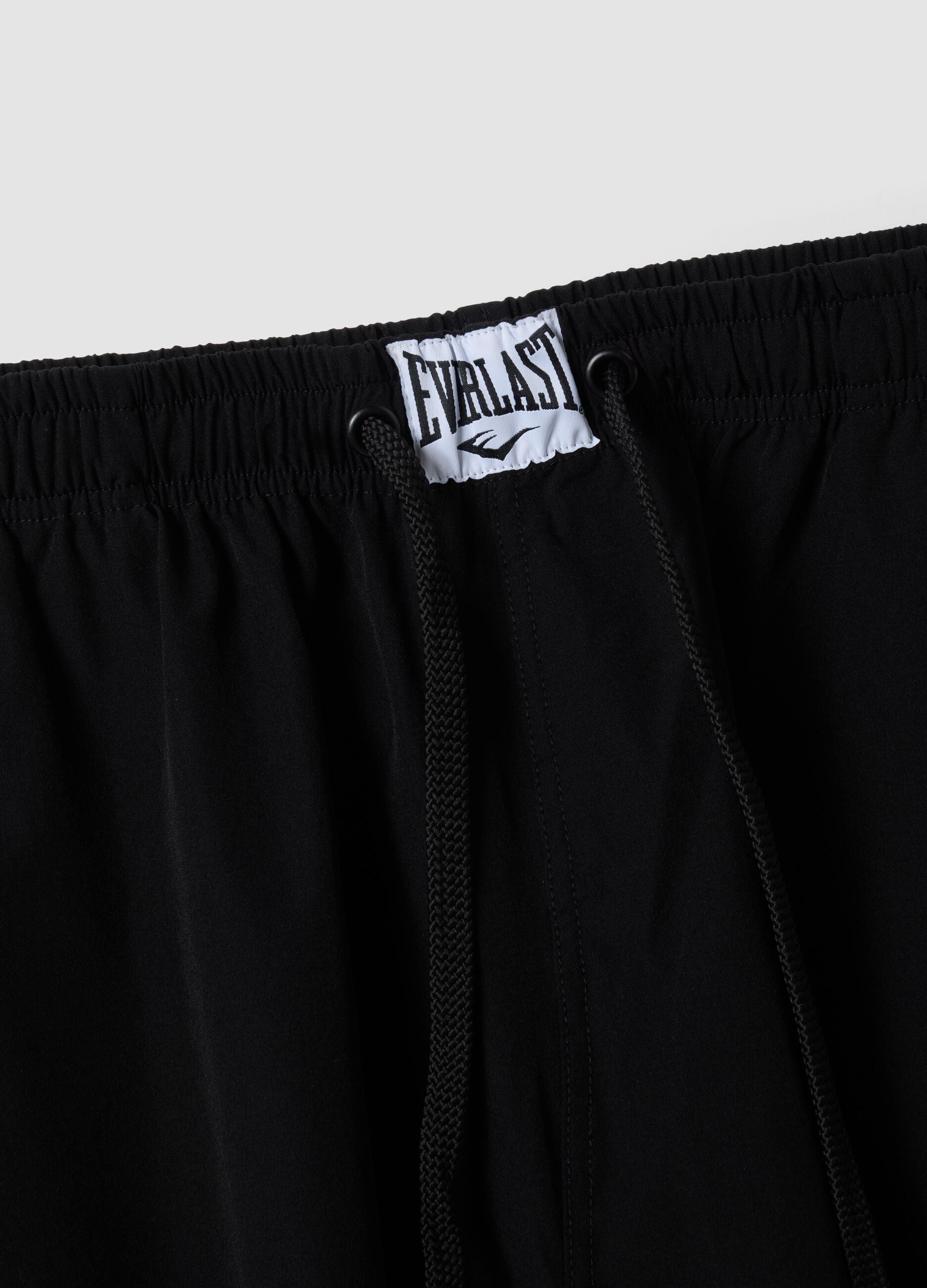 Black sporty cargo trousers with drawstring