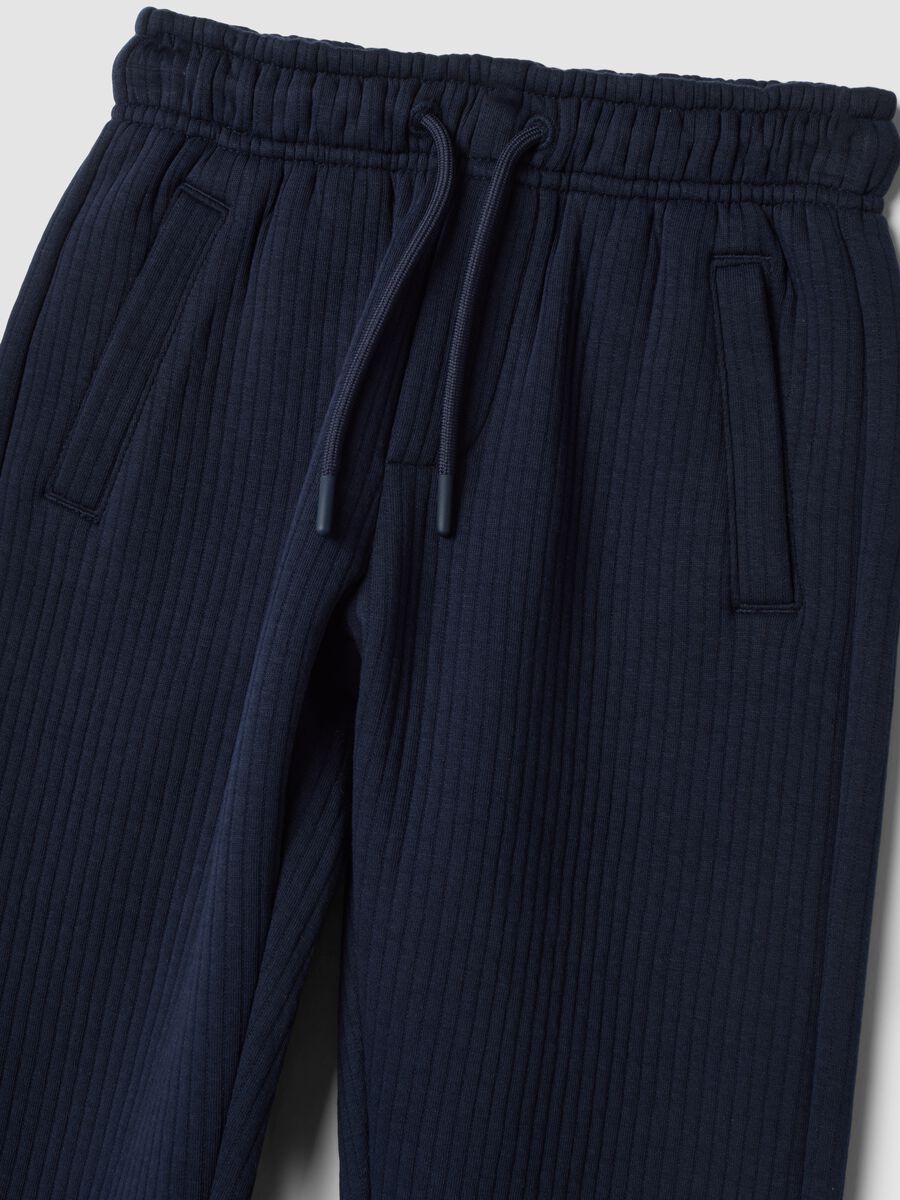 Blue ribbed cotton-blend trousers_1