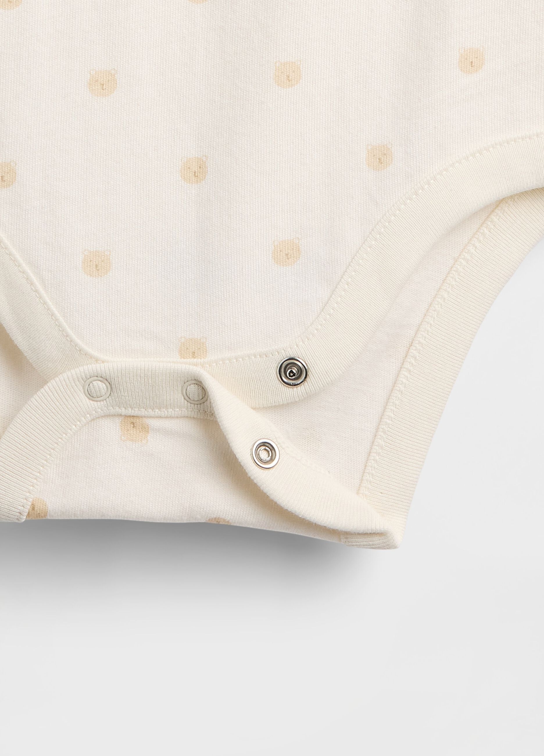 White cotton bodysuit with polka dots
