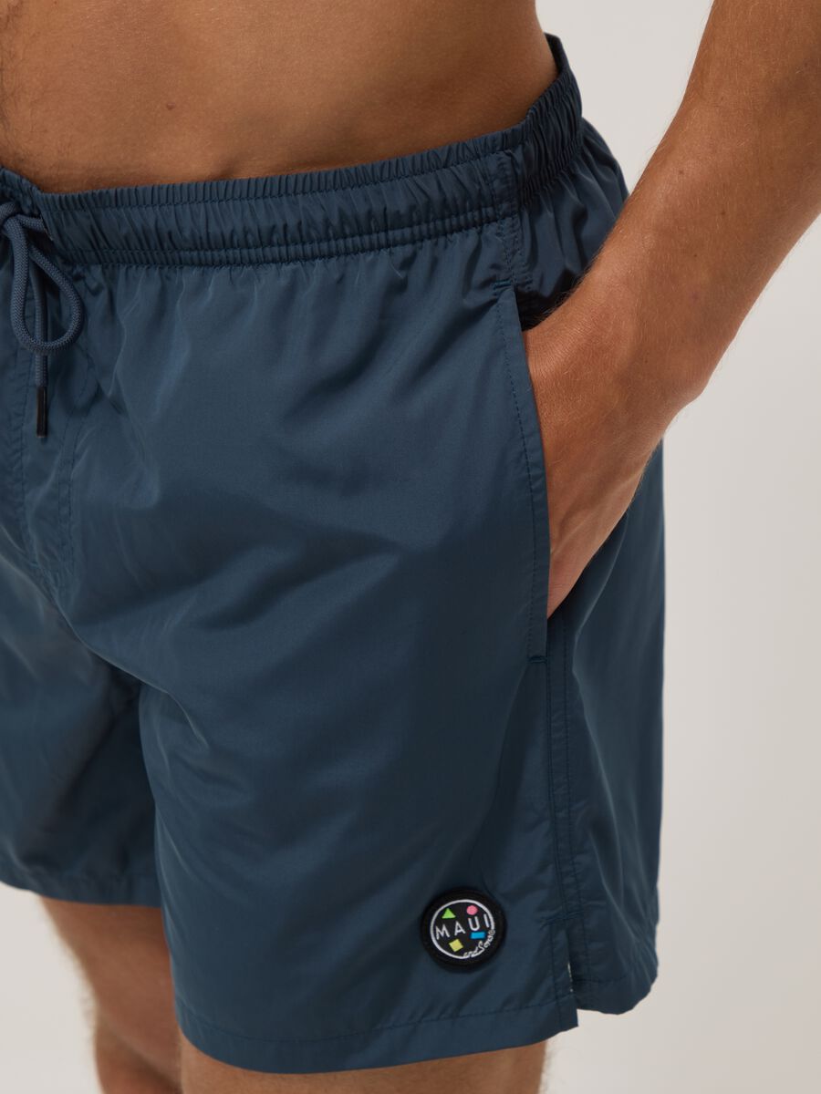 Blue swim shorts with elasticated waistband and drawstring_3