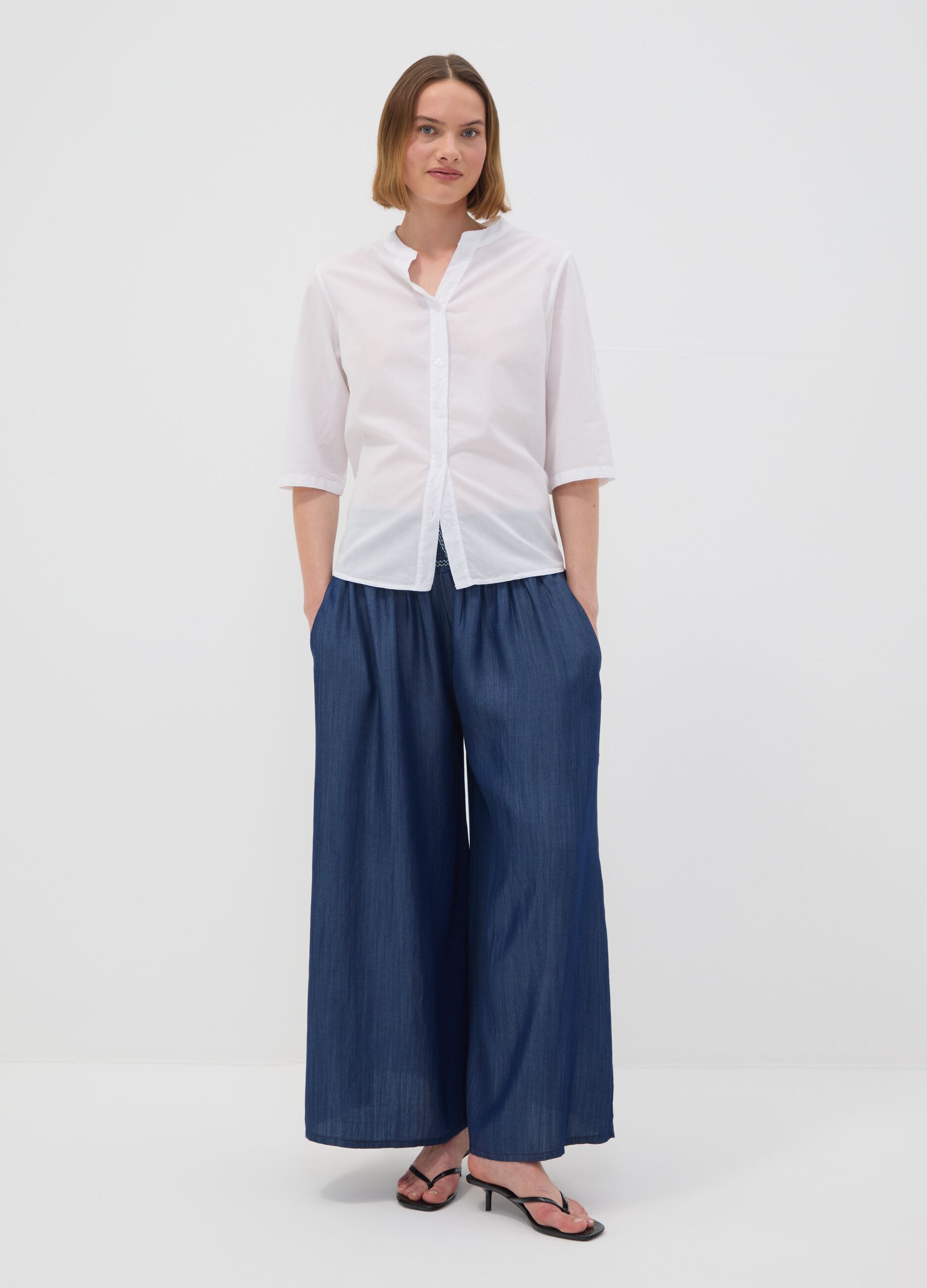 Wide-leg blue formal trousers in pure lyocell with embroidered waistband