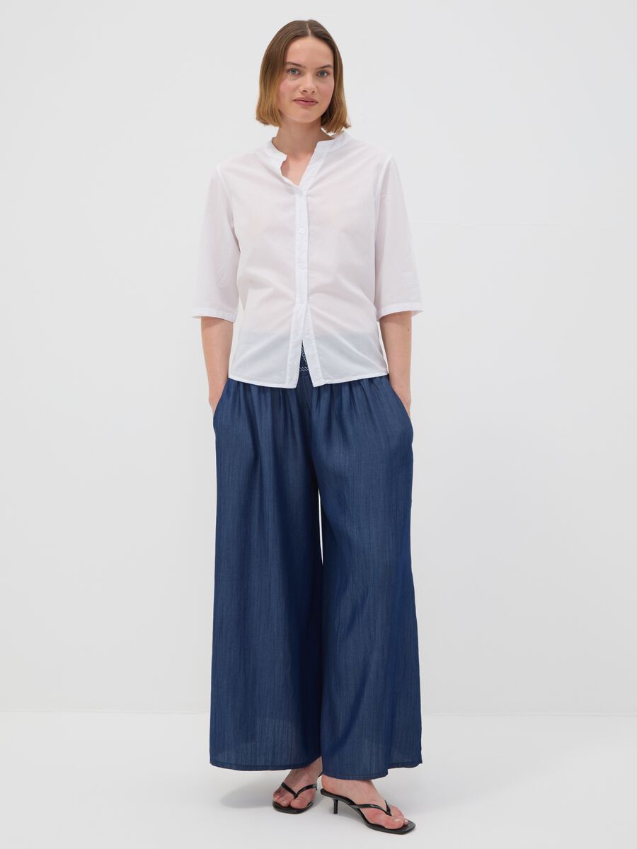 Wide-leg blue formal trousers in pure lyocell with embroidered waistband_0