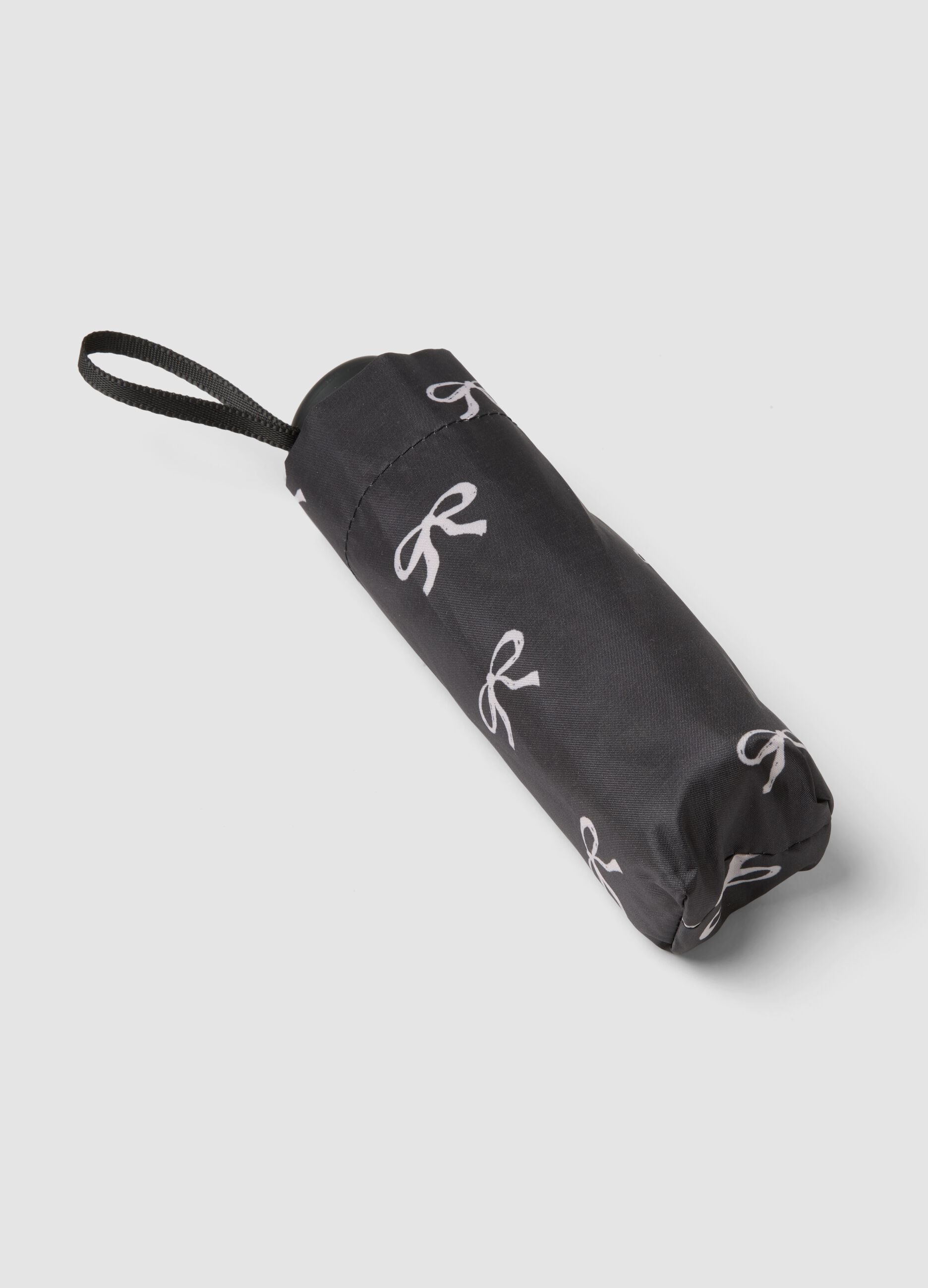 Black folding umbrella with bow print