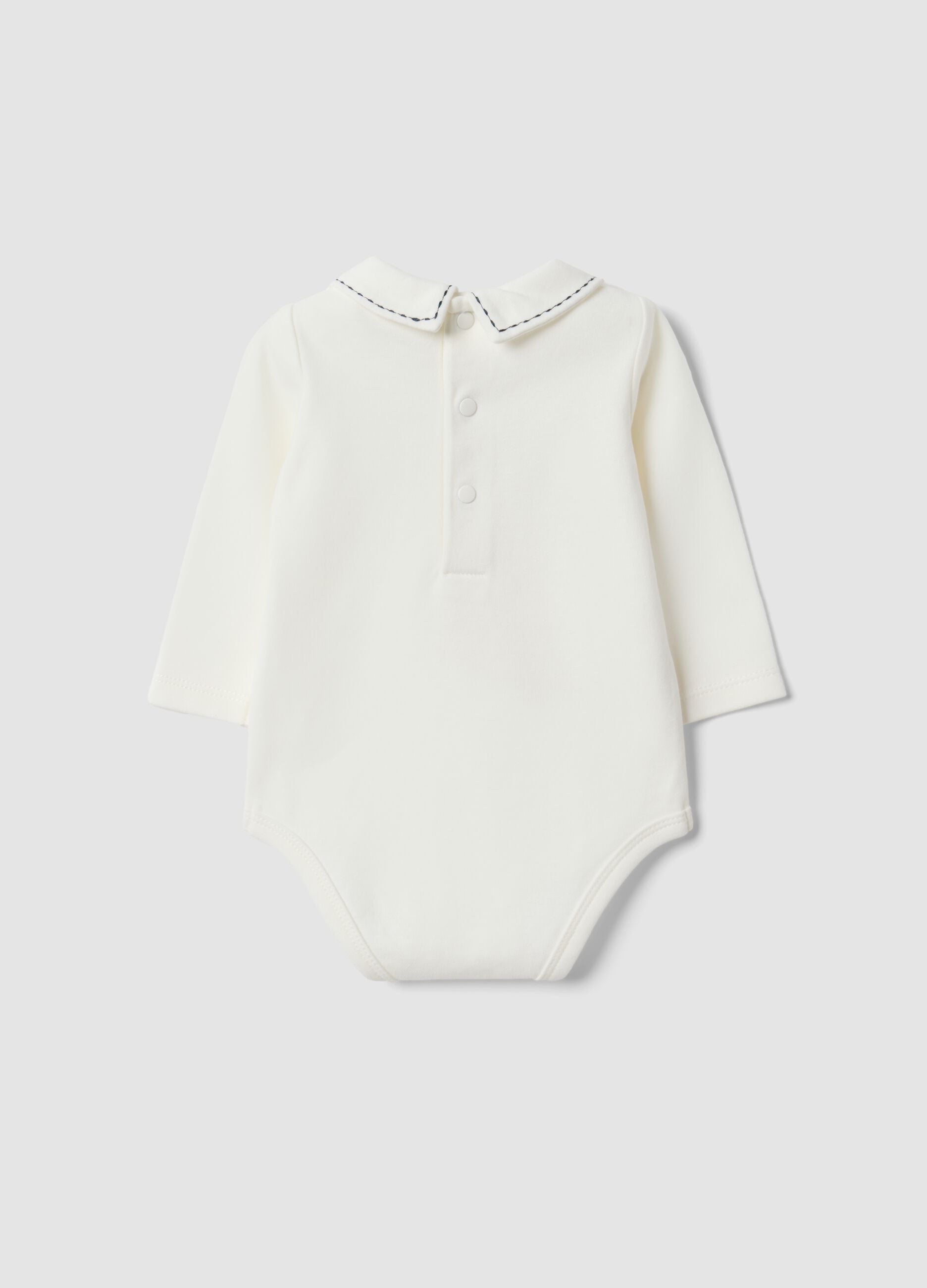 White organic cotton baby bodysuit with collar and dinosaur