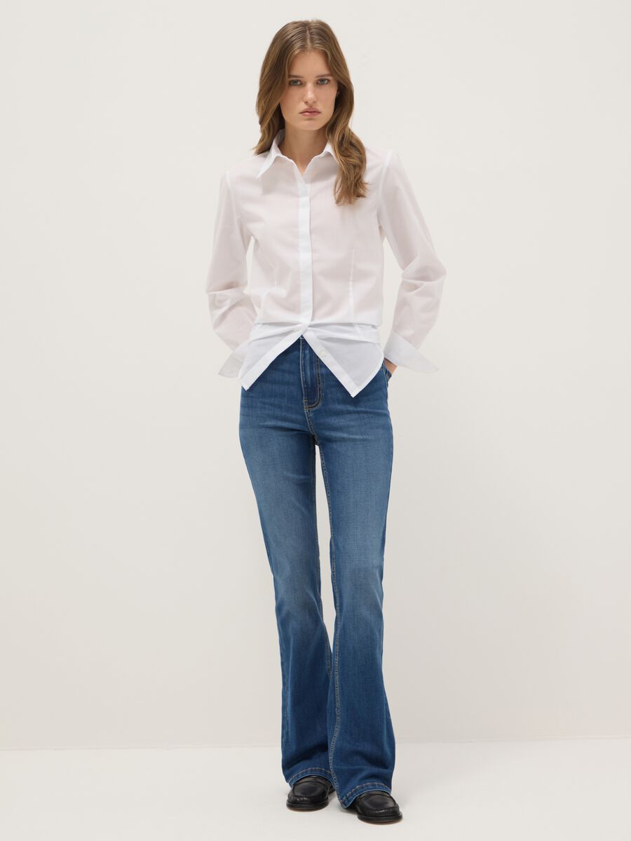 Blue cotton blend flare fit jeans_0