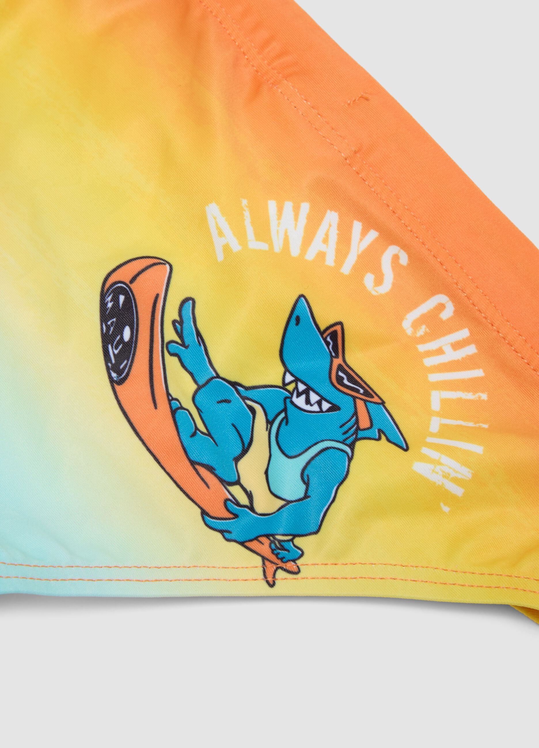 Orange and blue stretch swim briefs for boys