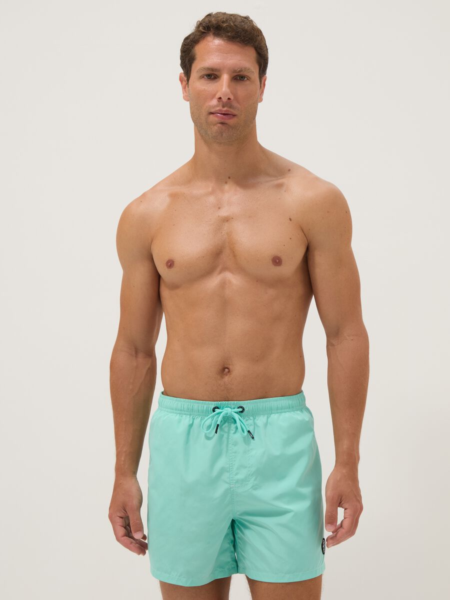 Light blue swim shorts with drawstring waist_0