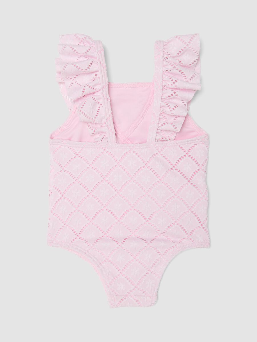 Costume intero rosa in tessuto elasticizzato con volant_1