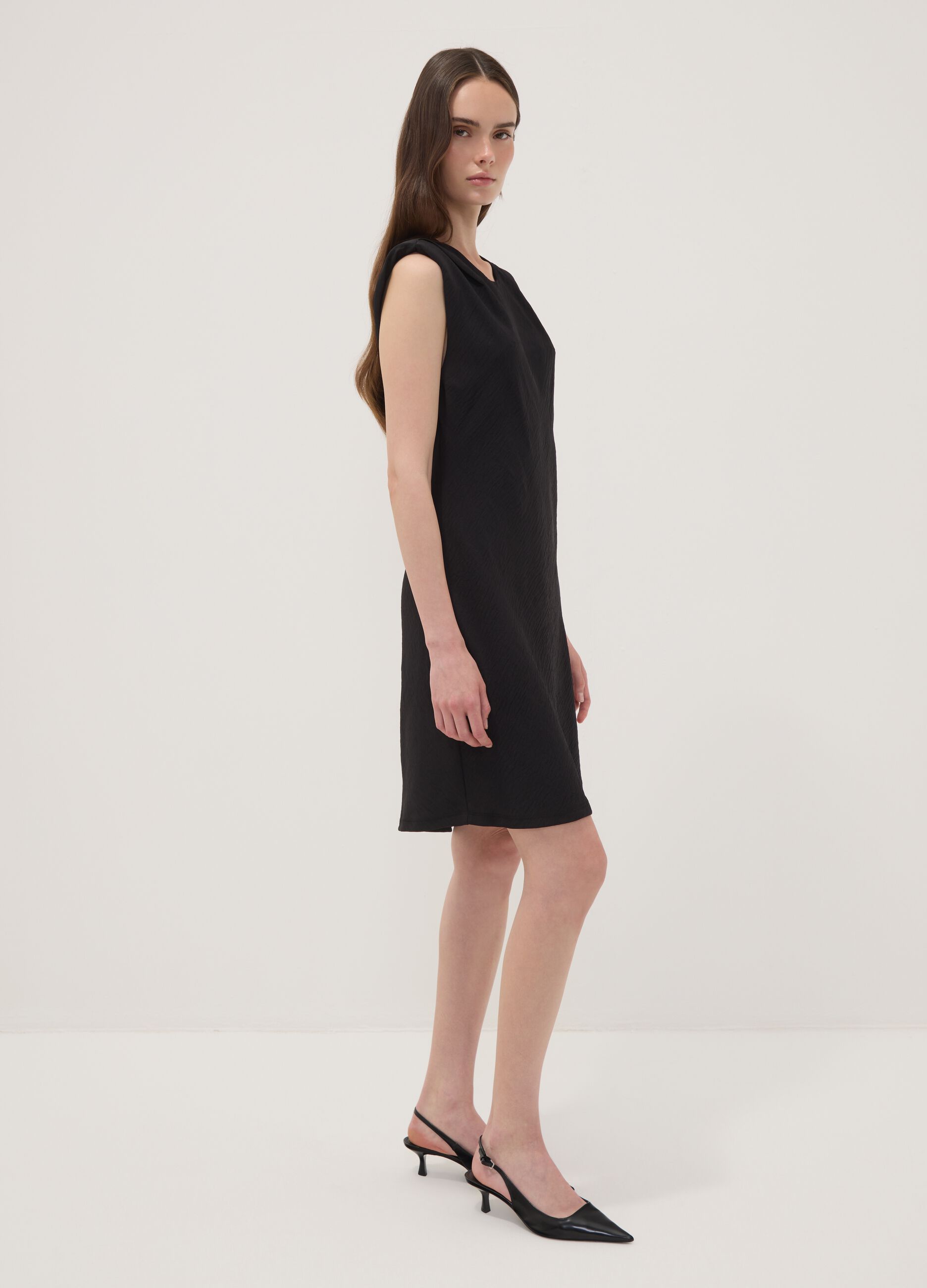 Black fitted dress with ruched detailing