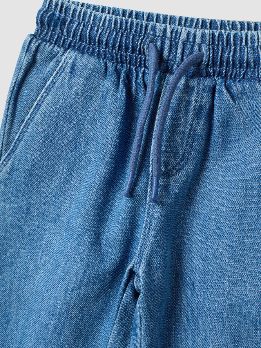 Blue denim trousers in a cotton and viscose blend with an elasticated waistband_2