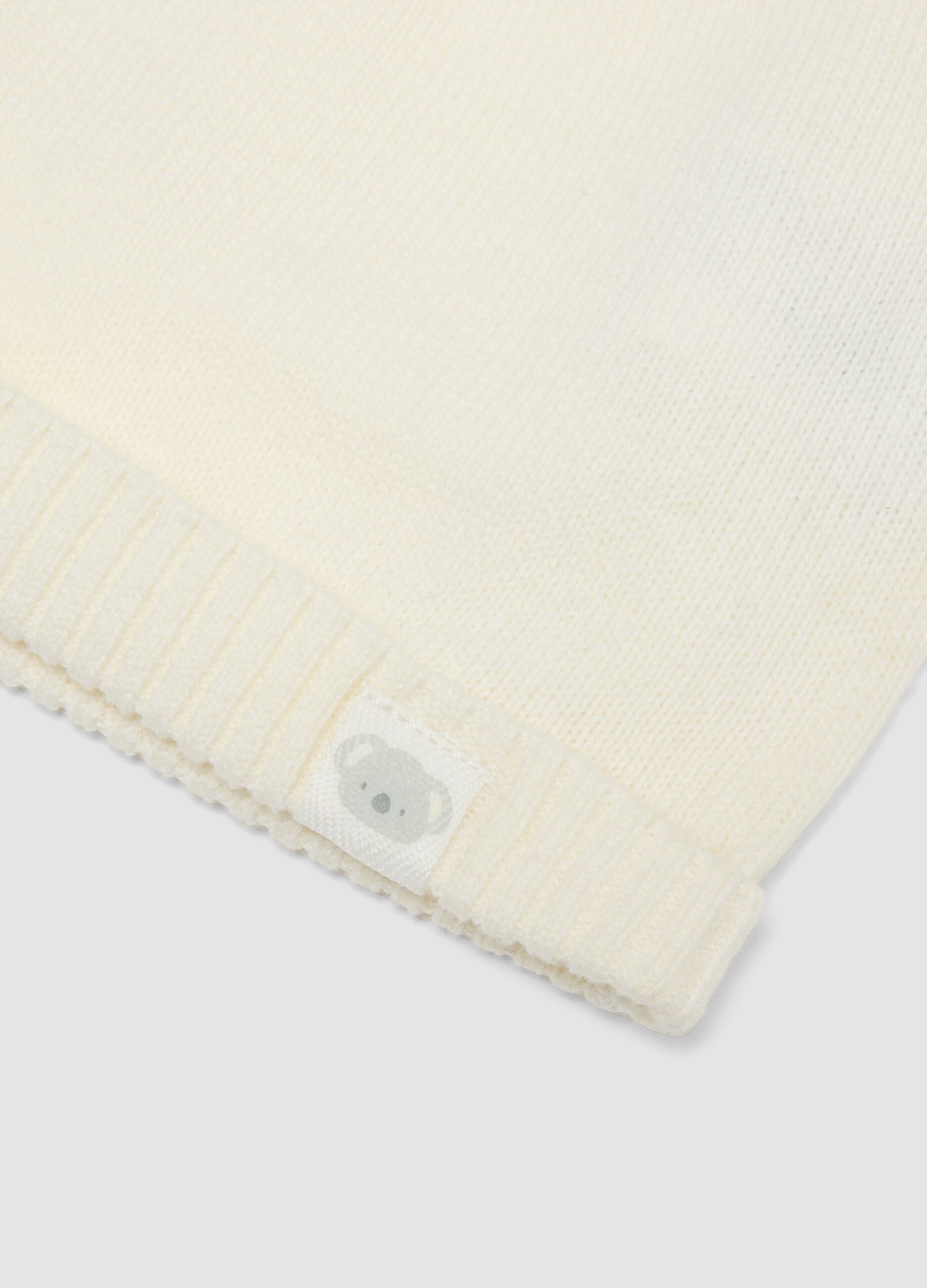 White pure organic cotton knitted baby hat with pom‑poms