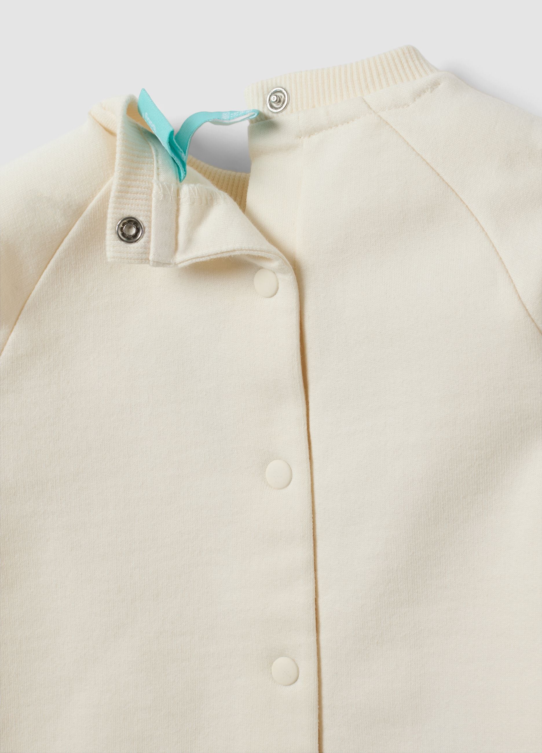 White organic cotton baby sleepsuit with Stitch print