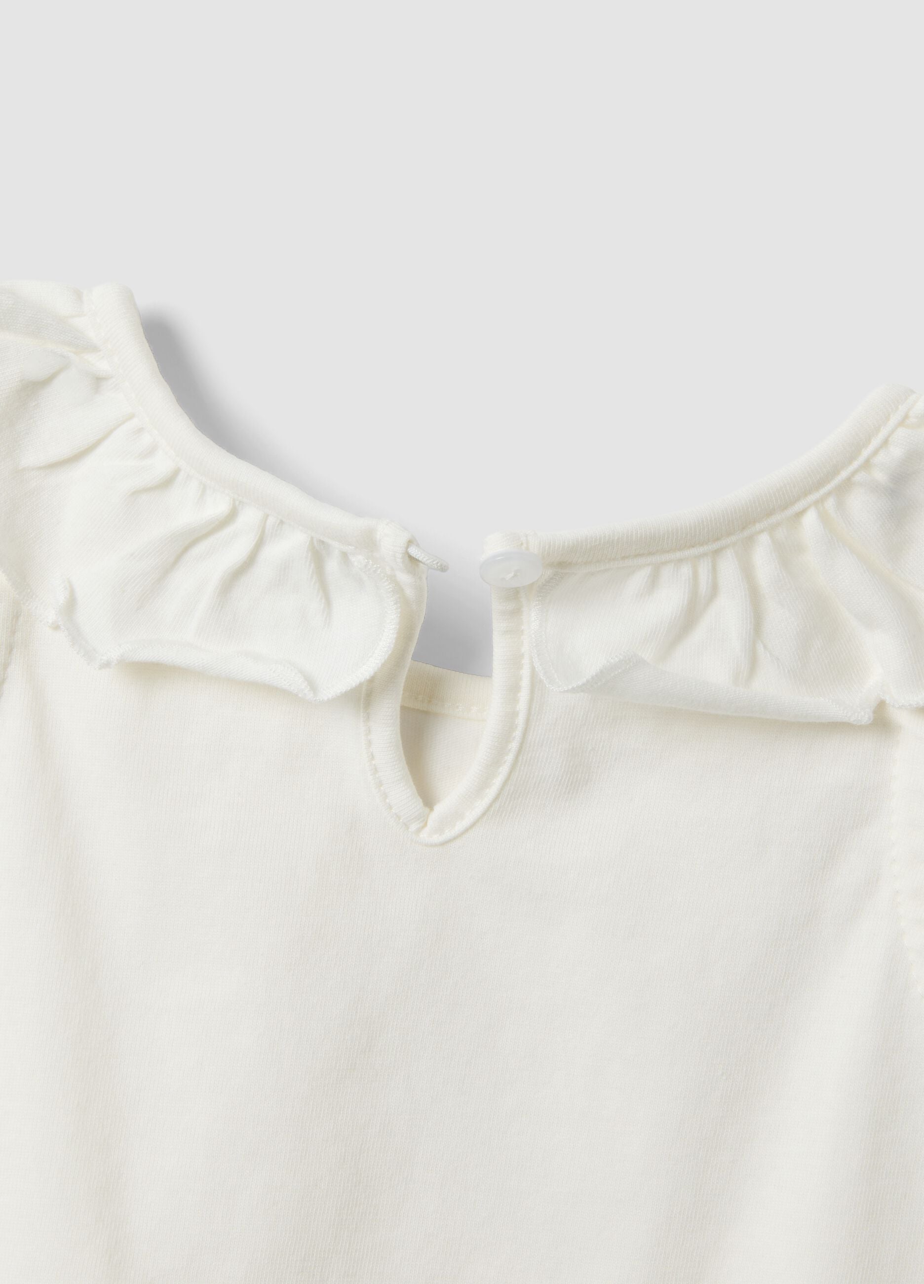 White organic cotton tank top with ruffle trim